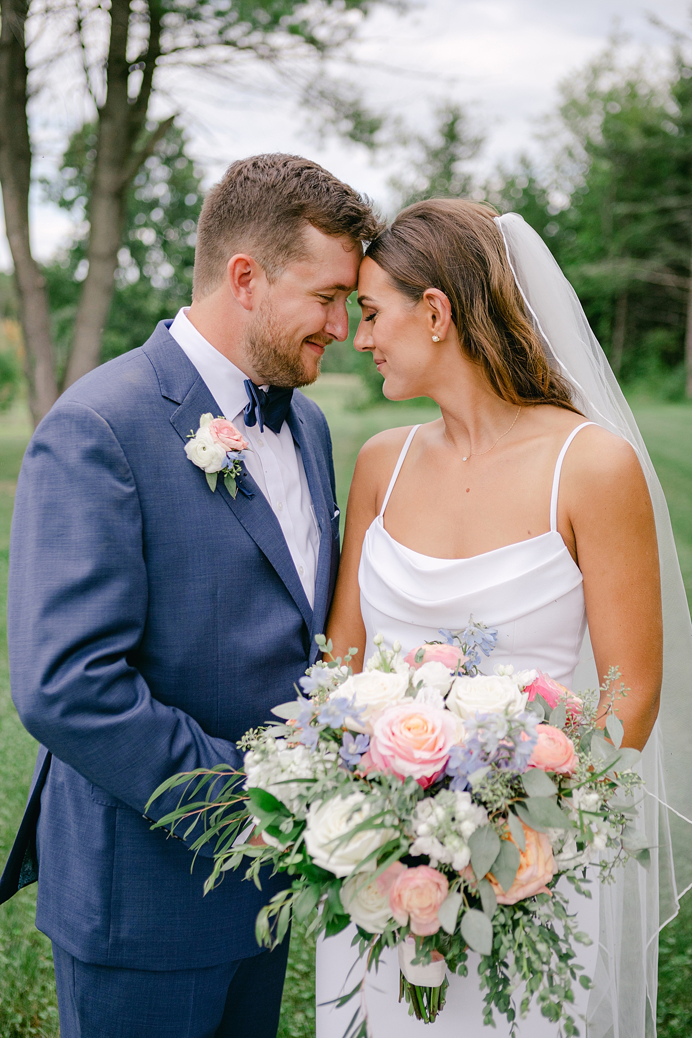 Close up of bride and groom with foreheads together | Image by Hope Helmuth Photography
