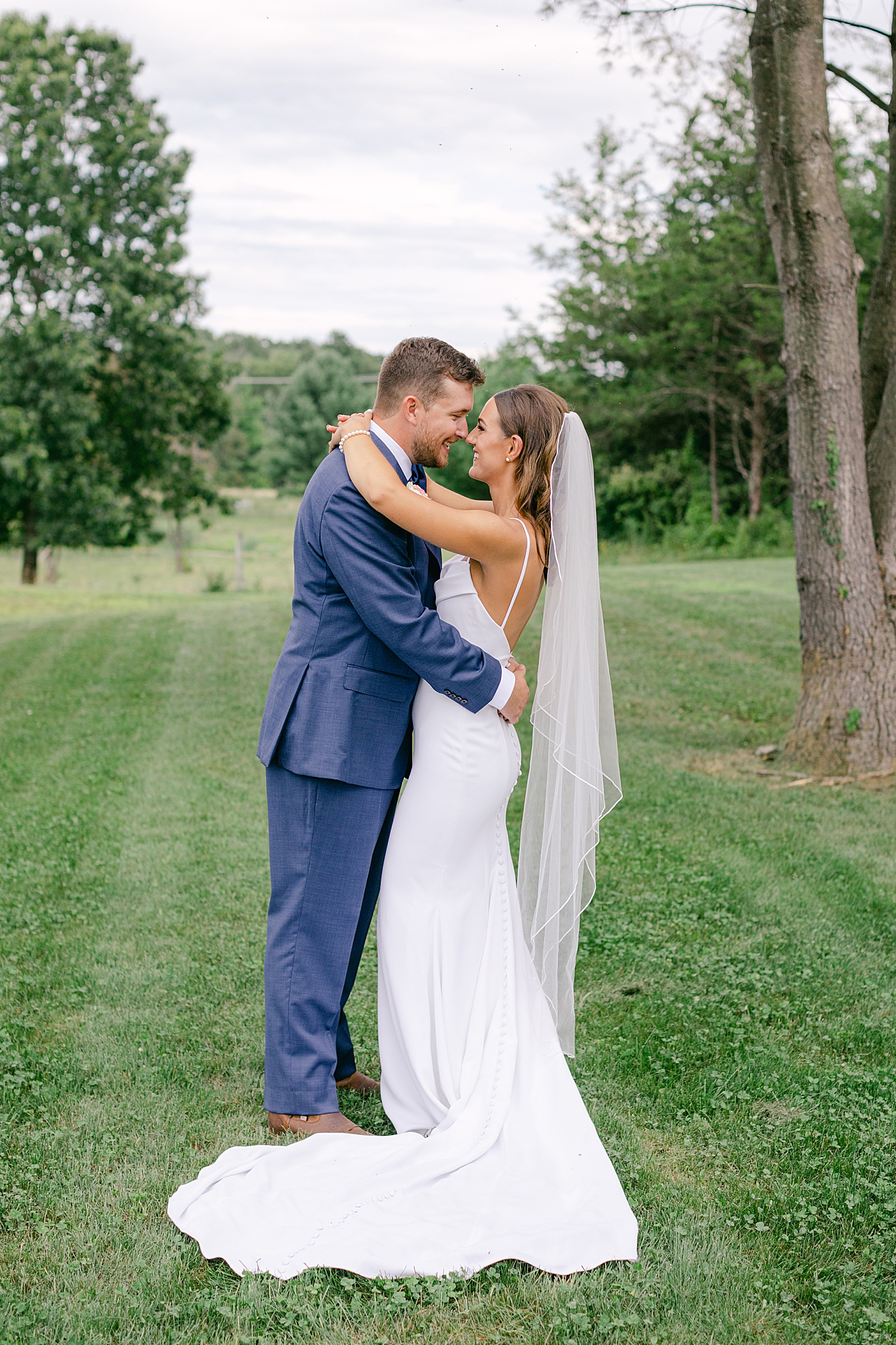 Bride and groom embracing during portraits | Image by Hope Helmuth Photography
