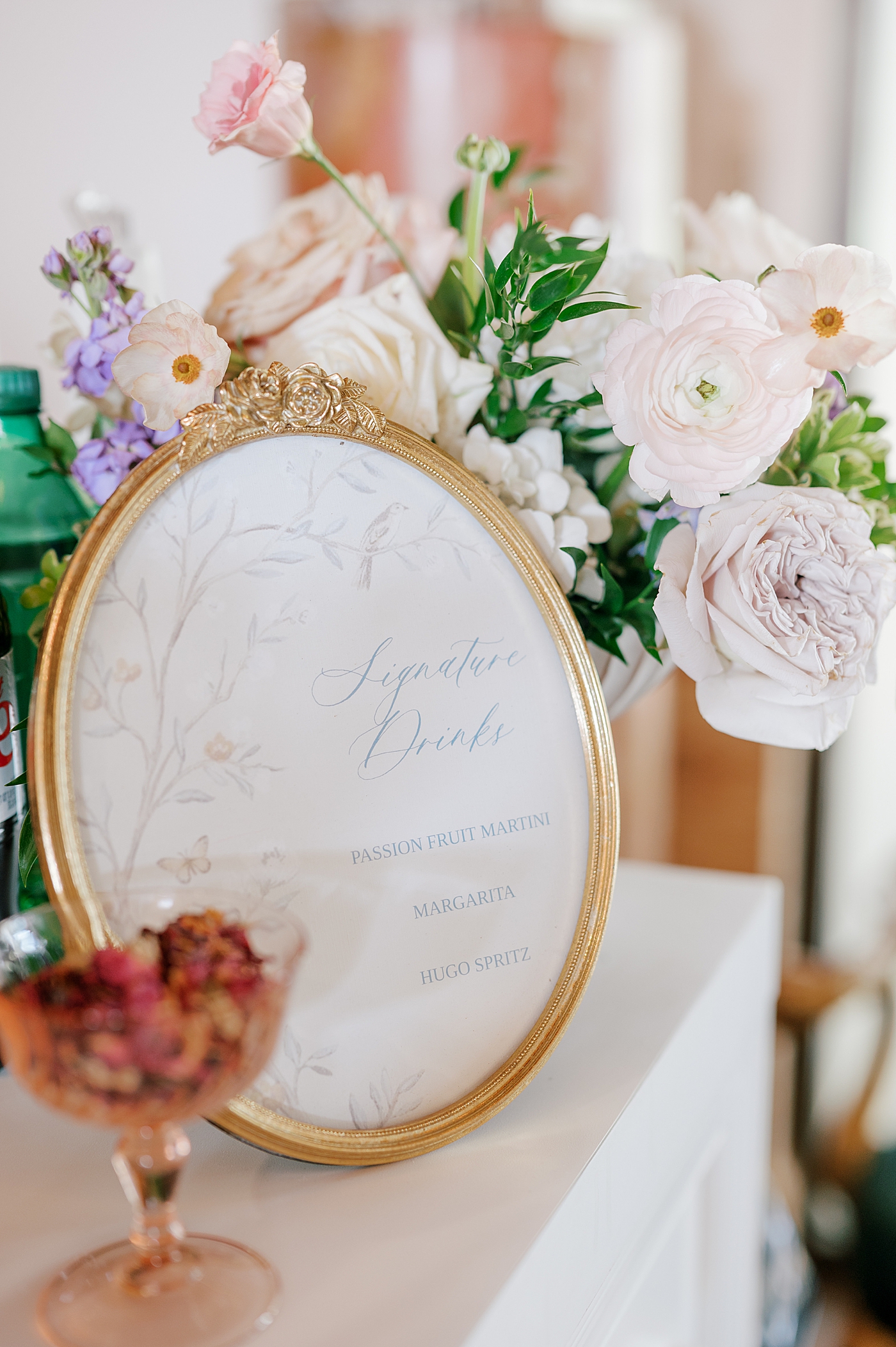 Custom wedding signage with florals | Image by Hope Helmuth Photography