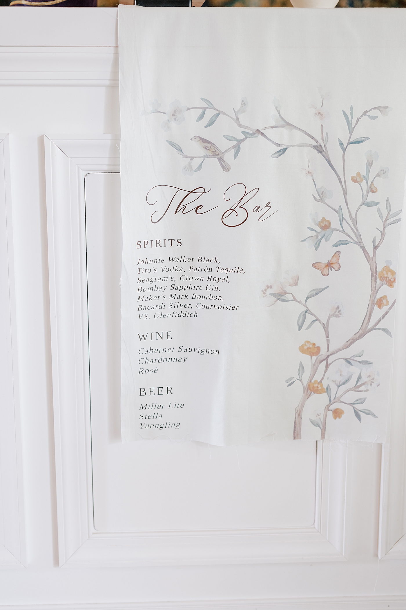 Custom bar signage with butterfly and olive tree illustration | Image by Hope Helmuth Photography
