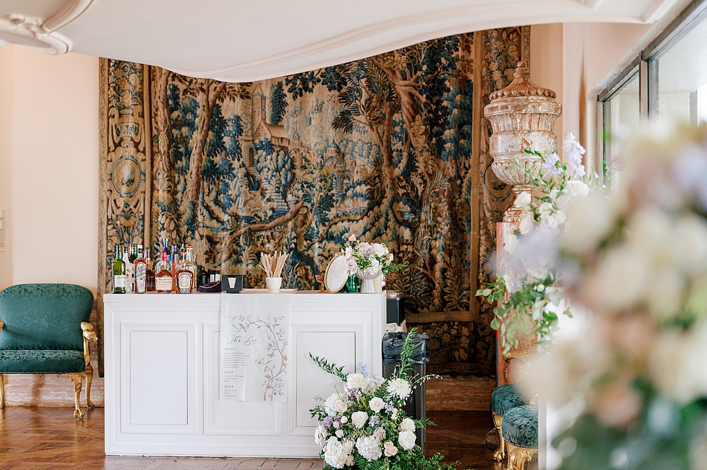Wedding bar decorated with flowers and greenery | Image by Hope Helmuth Photography