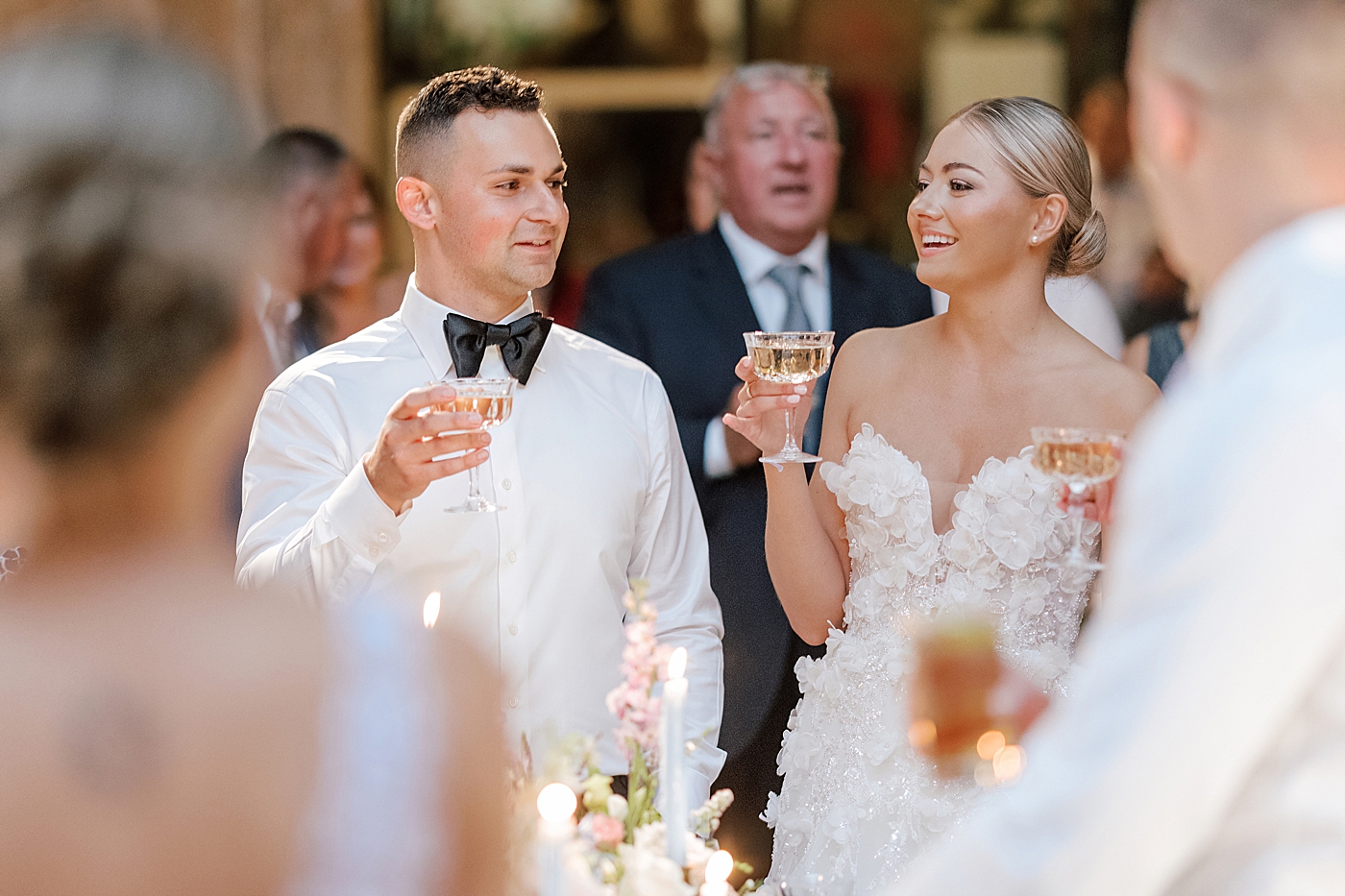 Bride and groom toast during reception | Image by Hope Helmuth Photography