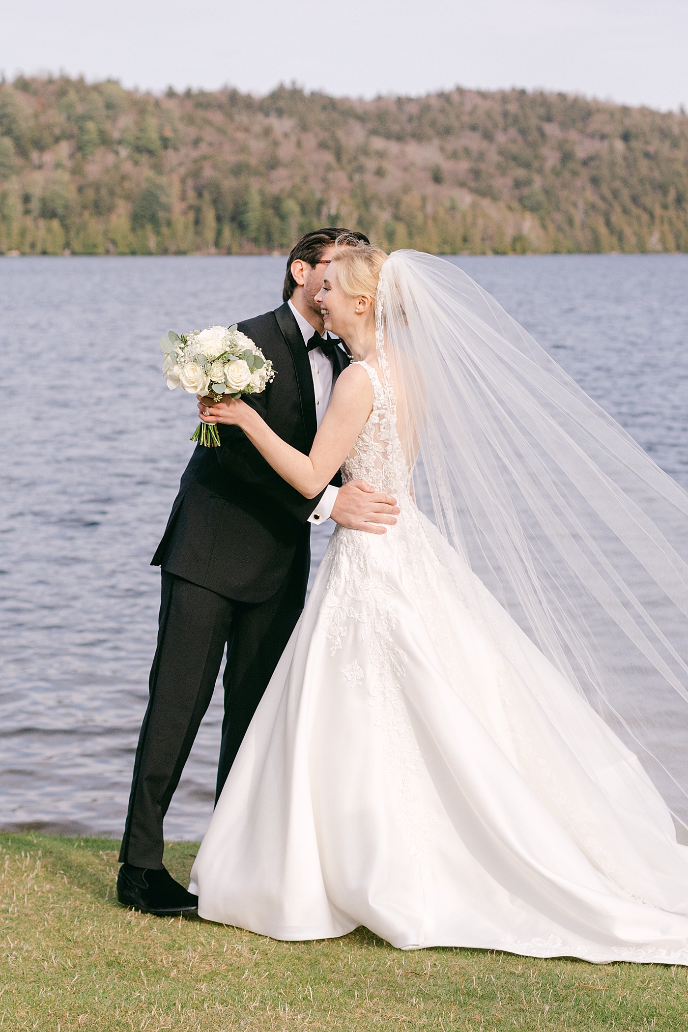 Bride and groom embracing | Image by Hope Helmuth Photography