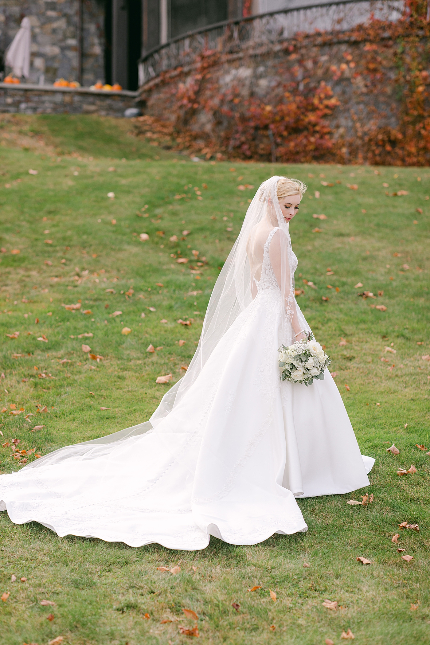 Bride in a veil during Lake Placid Lodge Wedding | Image by Hope Helmuth Photography