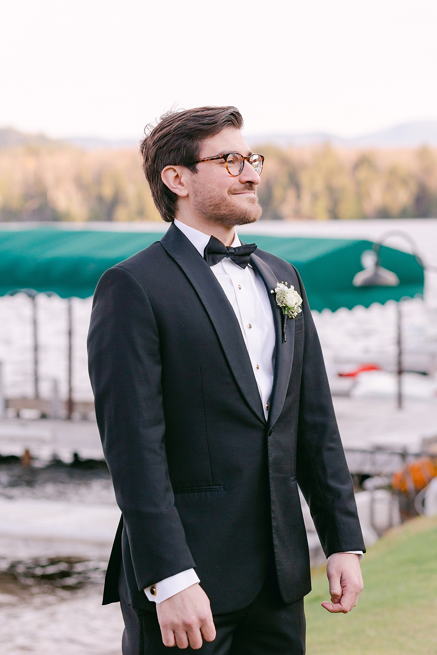 Groom watching bride walk down the aisle | Image by Hope Helmuth Photography
