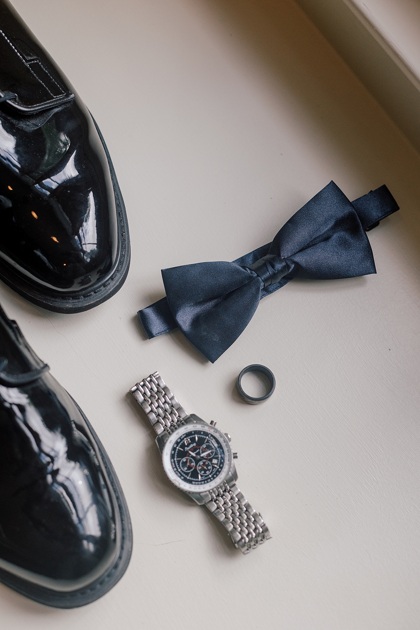 Grooms details during River House Odette's Wedding | Image by Hope Helmuth Photography
