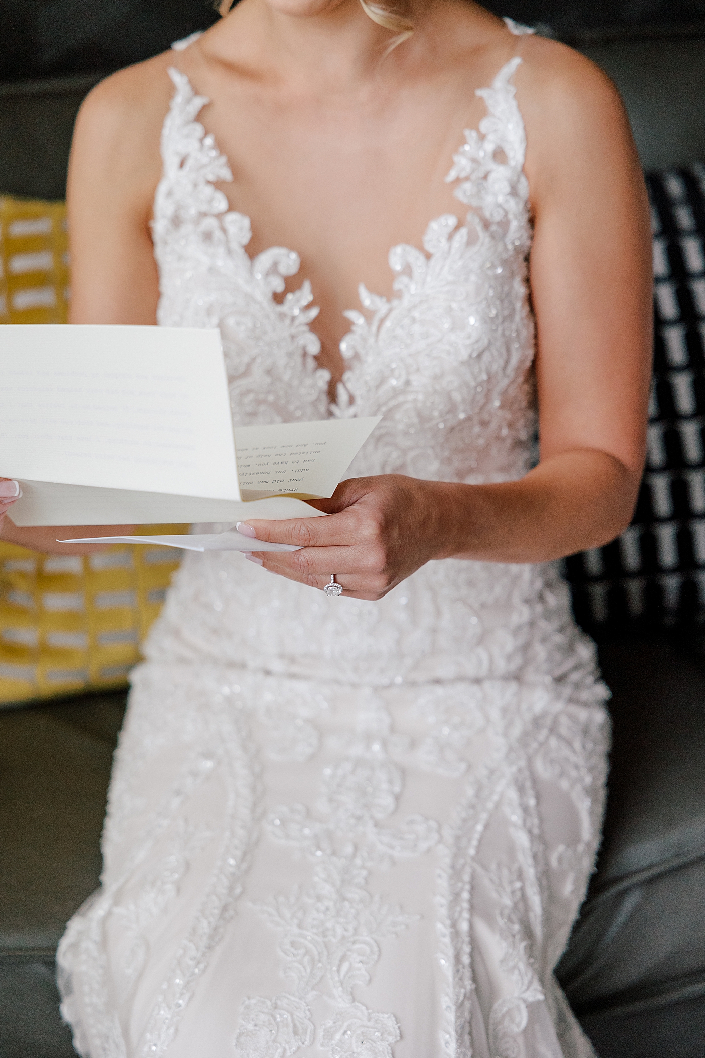 Bride reading a letter from groom | Image by Hope Helmuth Photography