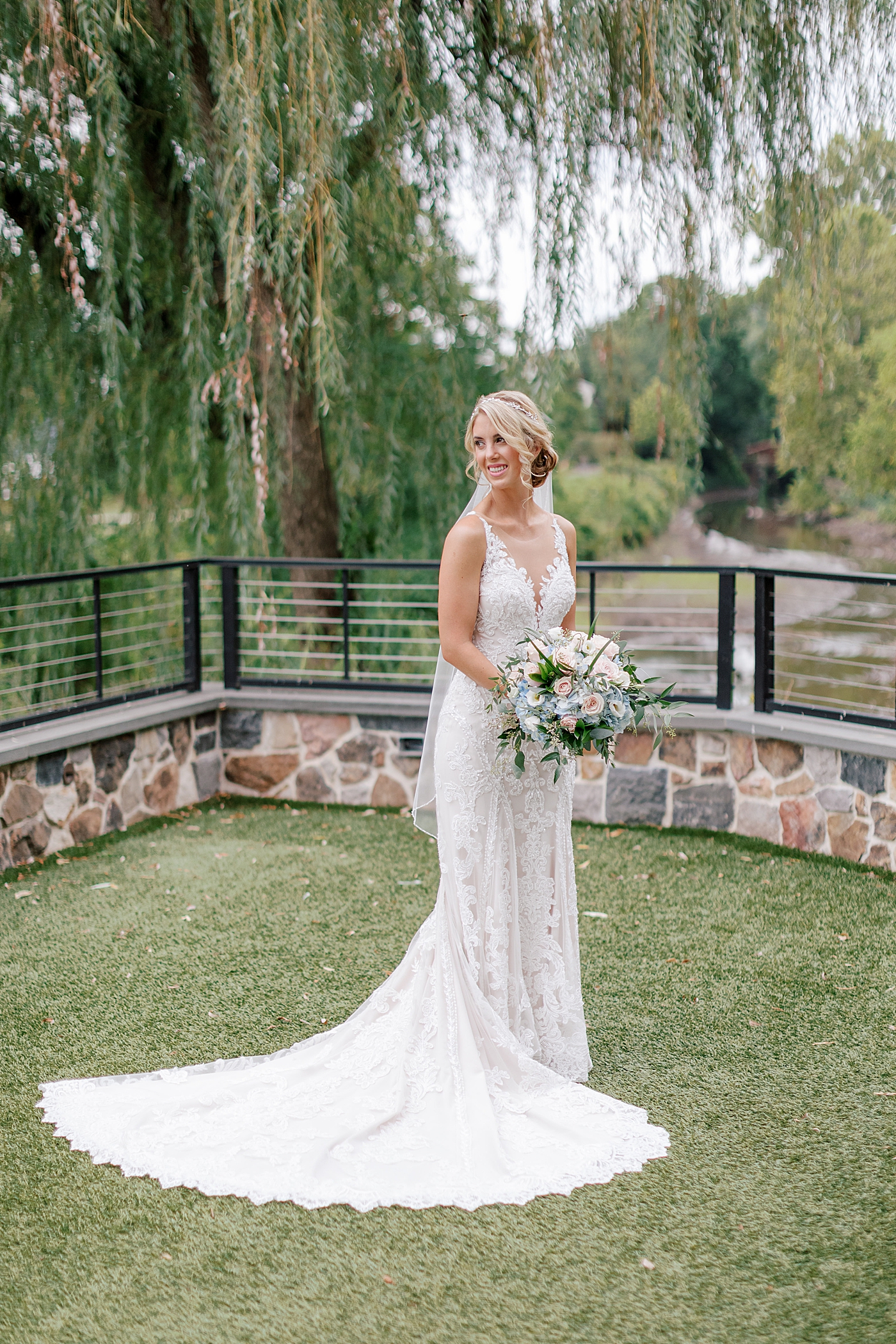 Bride holding her bouquet Image by Hope Helmuth Photography