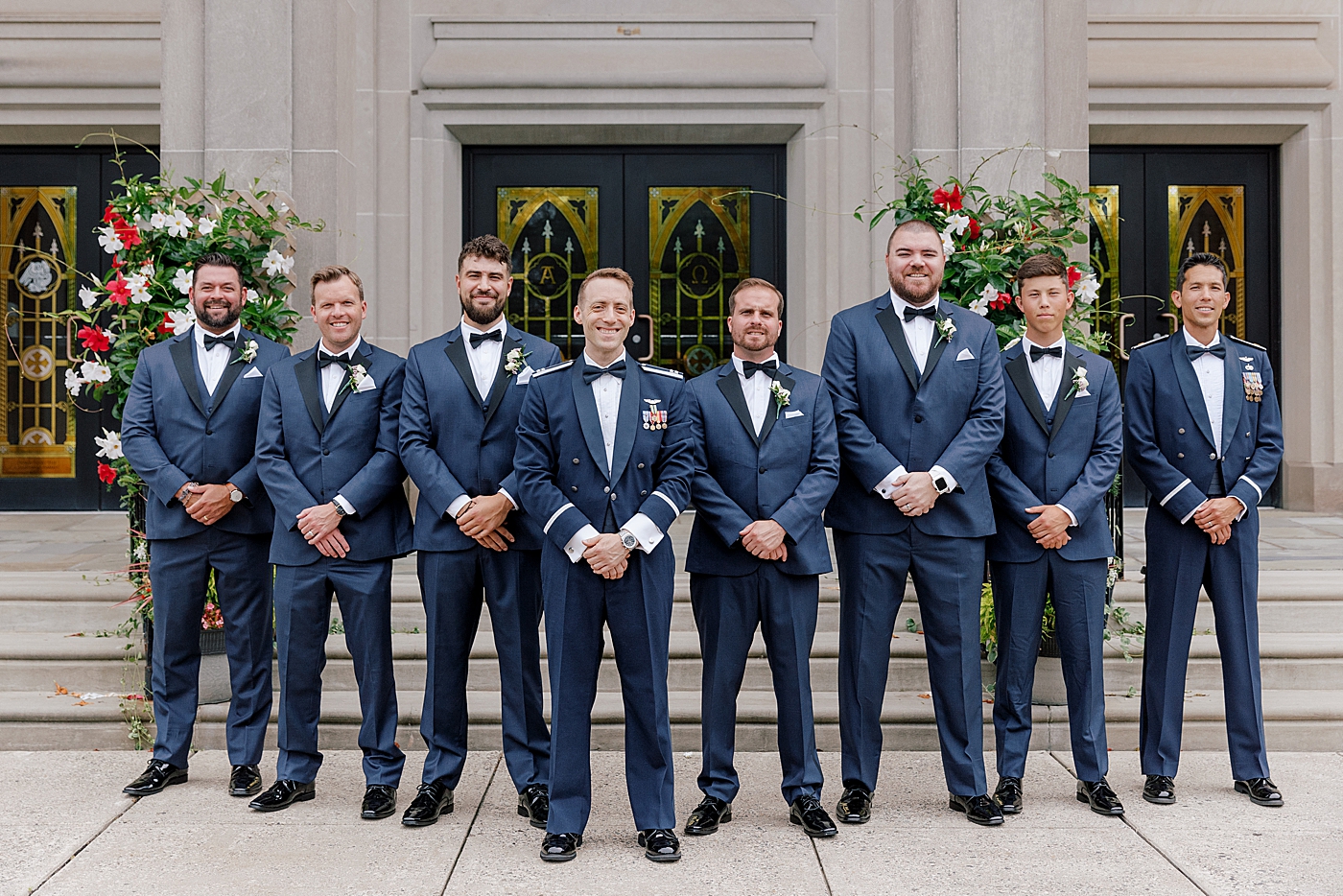 Groomsmen in front of wedding venue | Image by Hope Helmuth Photography