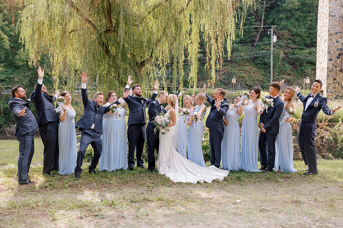Bride and groom with their wedding party | Image by Hope Helmuth Photography