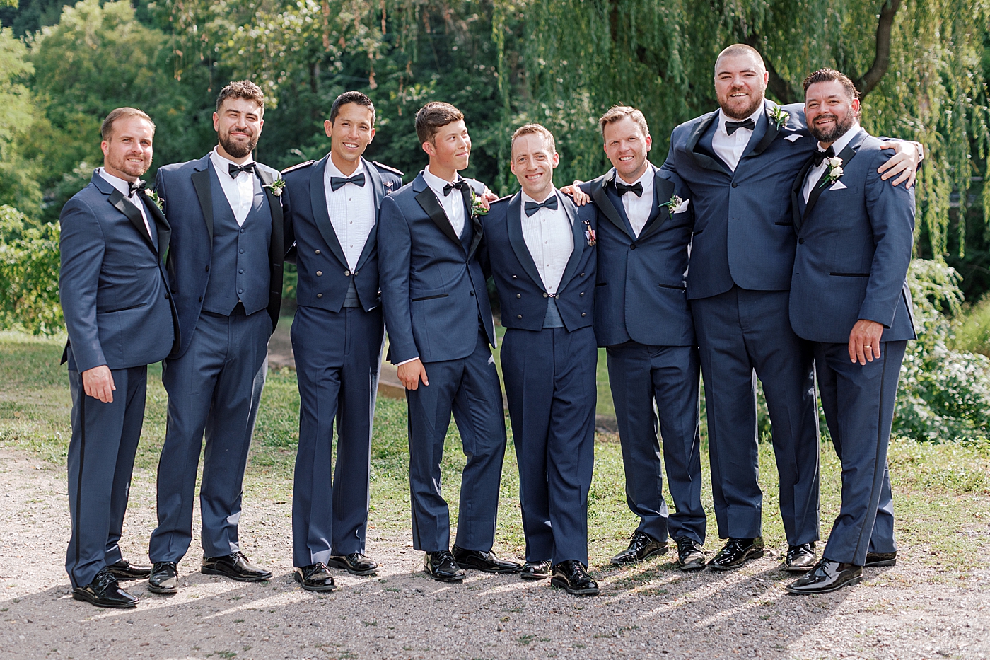 Groomsmen all in a line | Image by Hope Helmuth Photography