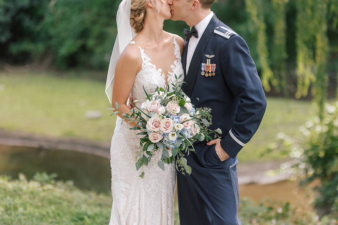 Detail of bride and groom kissing | Image by Hope Helmuth Photography