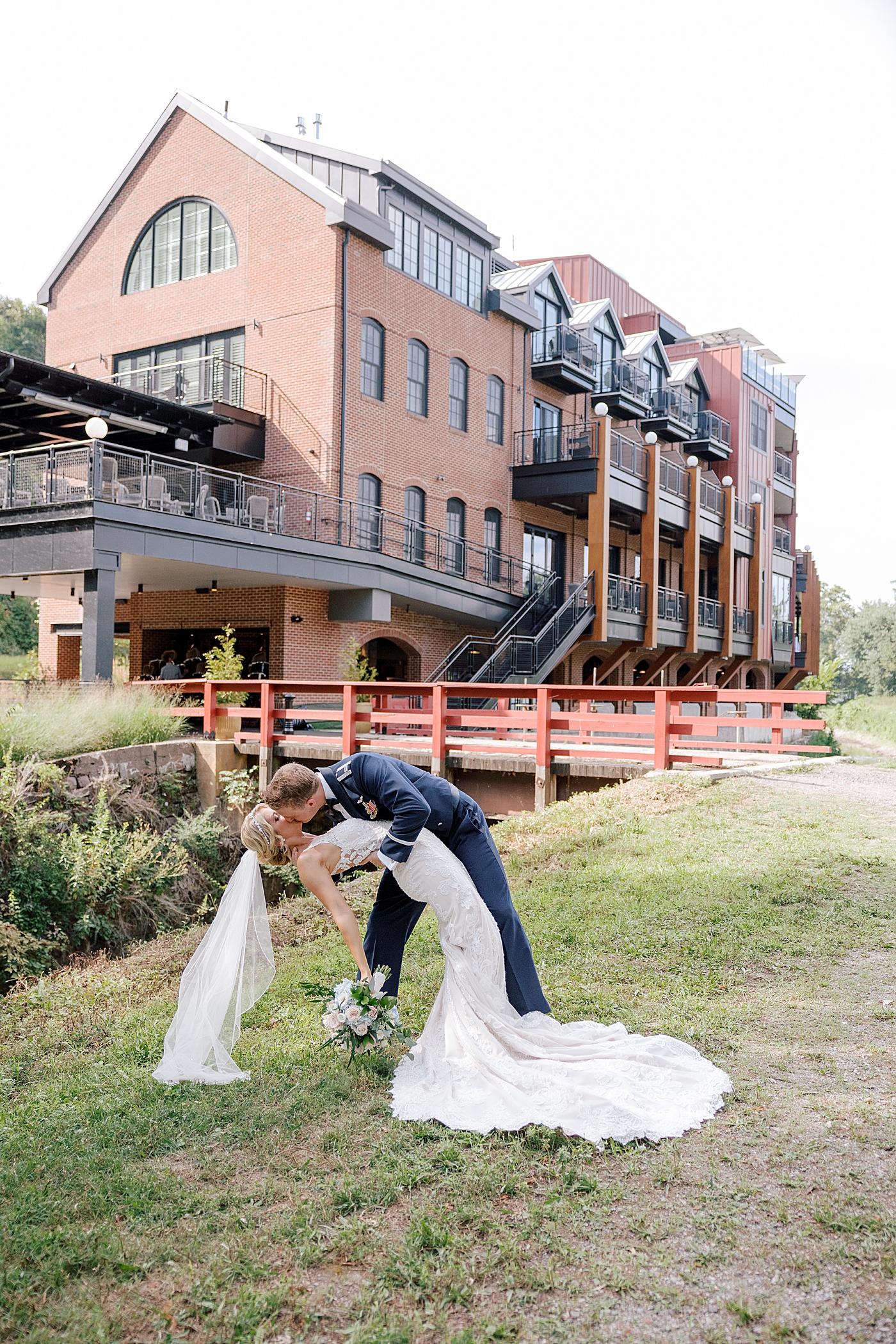 Bride and groom kiss after River House Odette's Wedding | Image by Hope Helmuth Photography