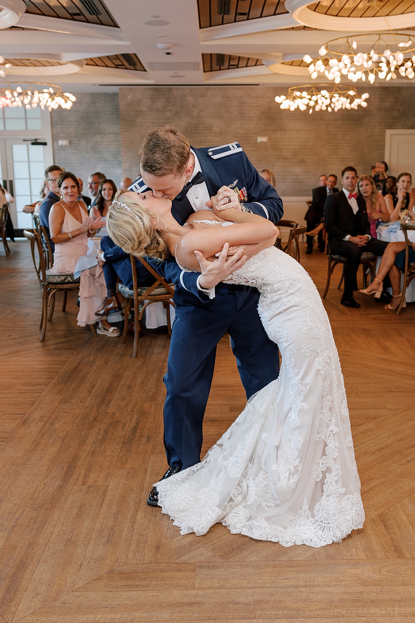 Bride and groom kiss during their first dance | Image by Hope Helmuth Photography