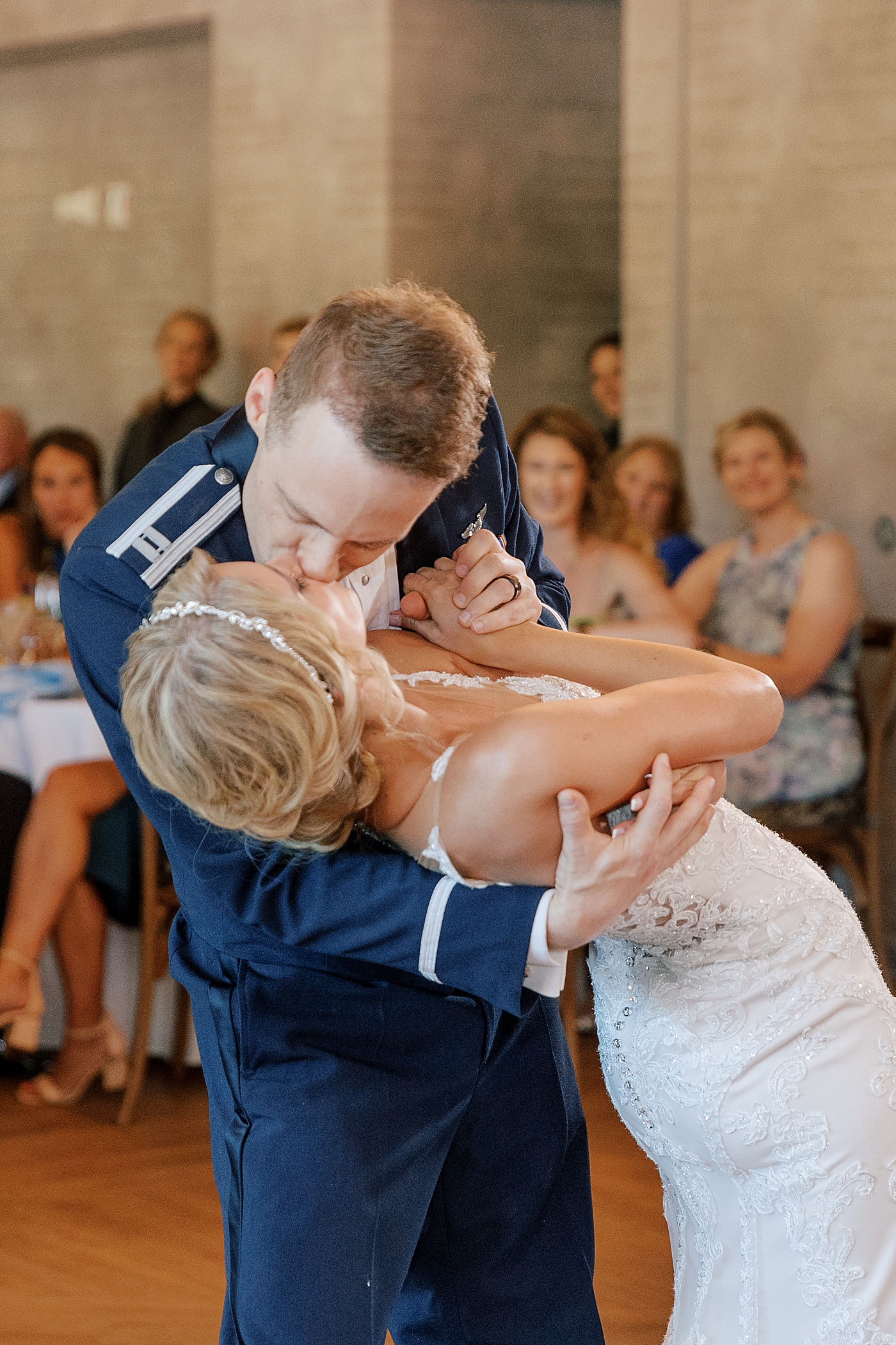 Bride and groom kiss during their first dance | Image by Hope Helmuth Photography