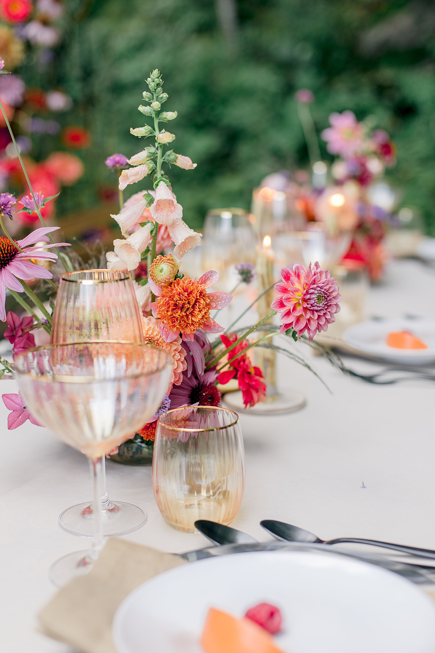 Detail of colorful flowers with wine glasses | Image by Hope Helmuth Photography
