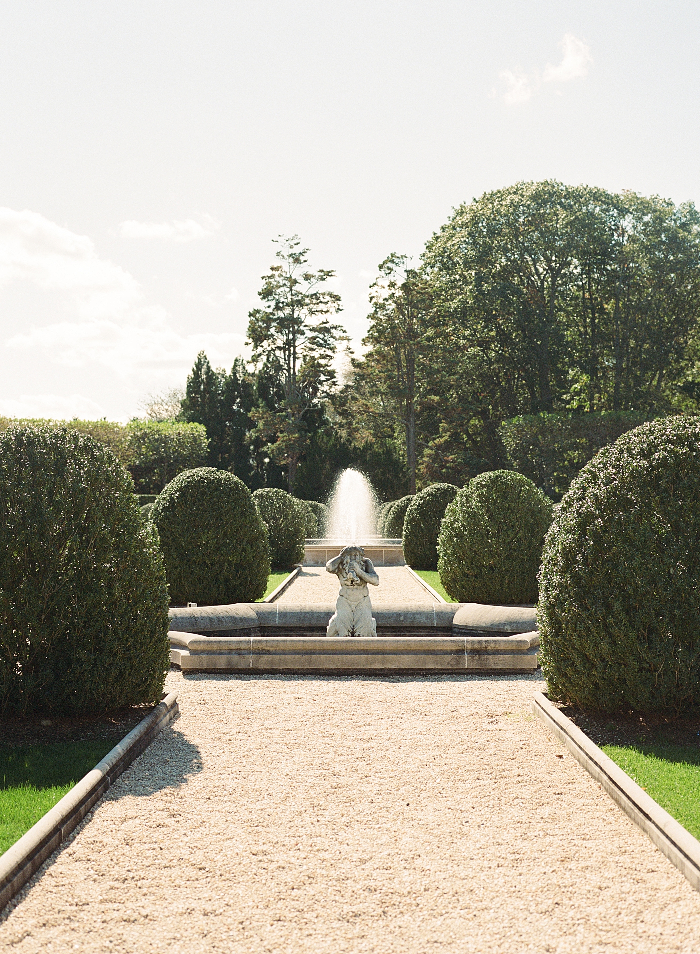 Image of a European garden with hedges, statues, and fountains | Image by Hope Helmuth Photography