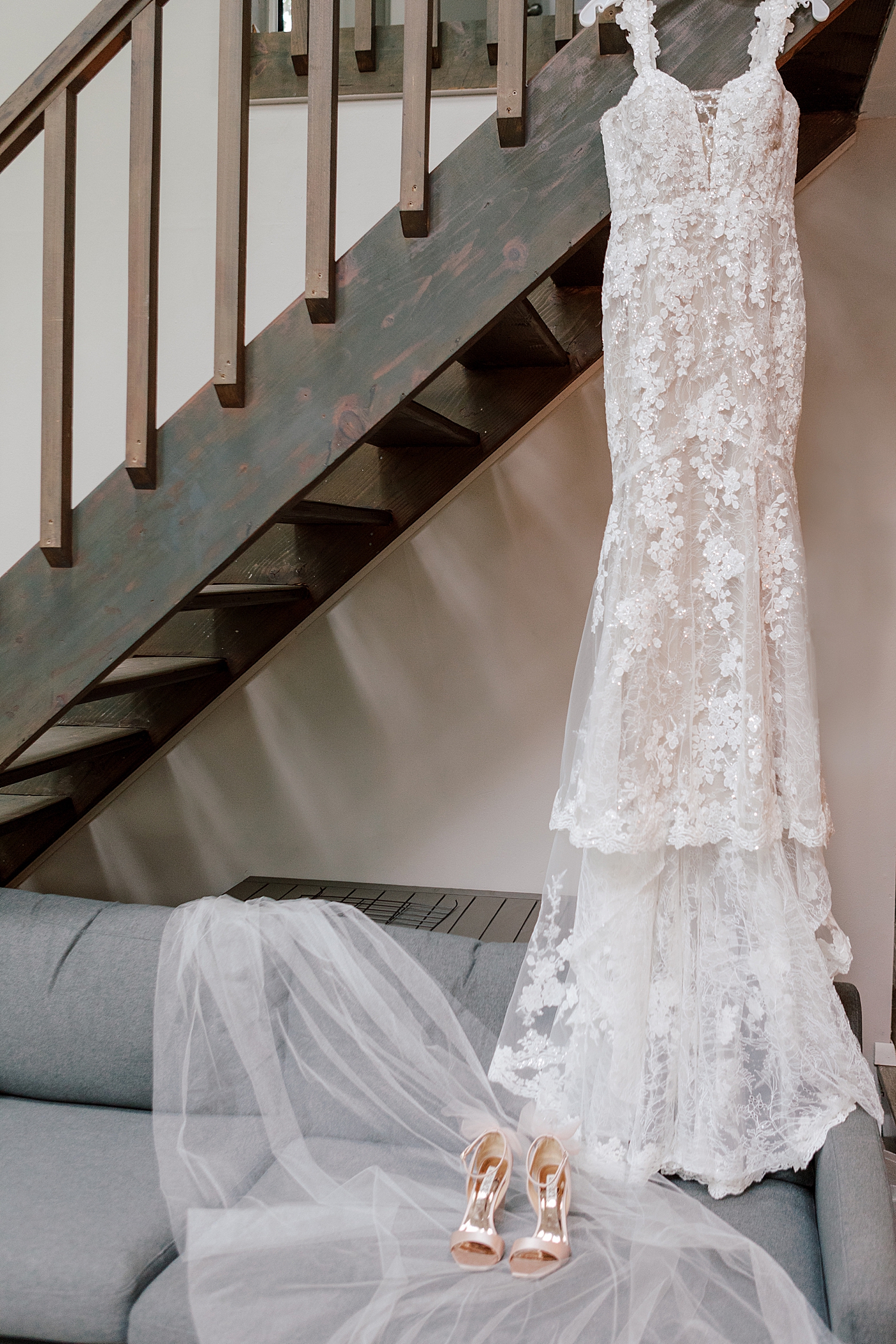 Bridal gown on a hanger during Promise Ridge Wedding | Image by Hope Helmuth Photography 
