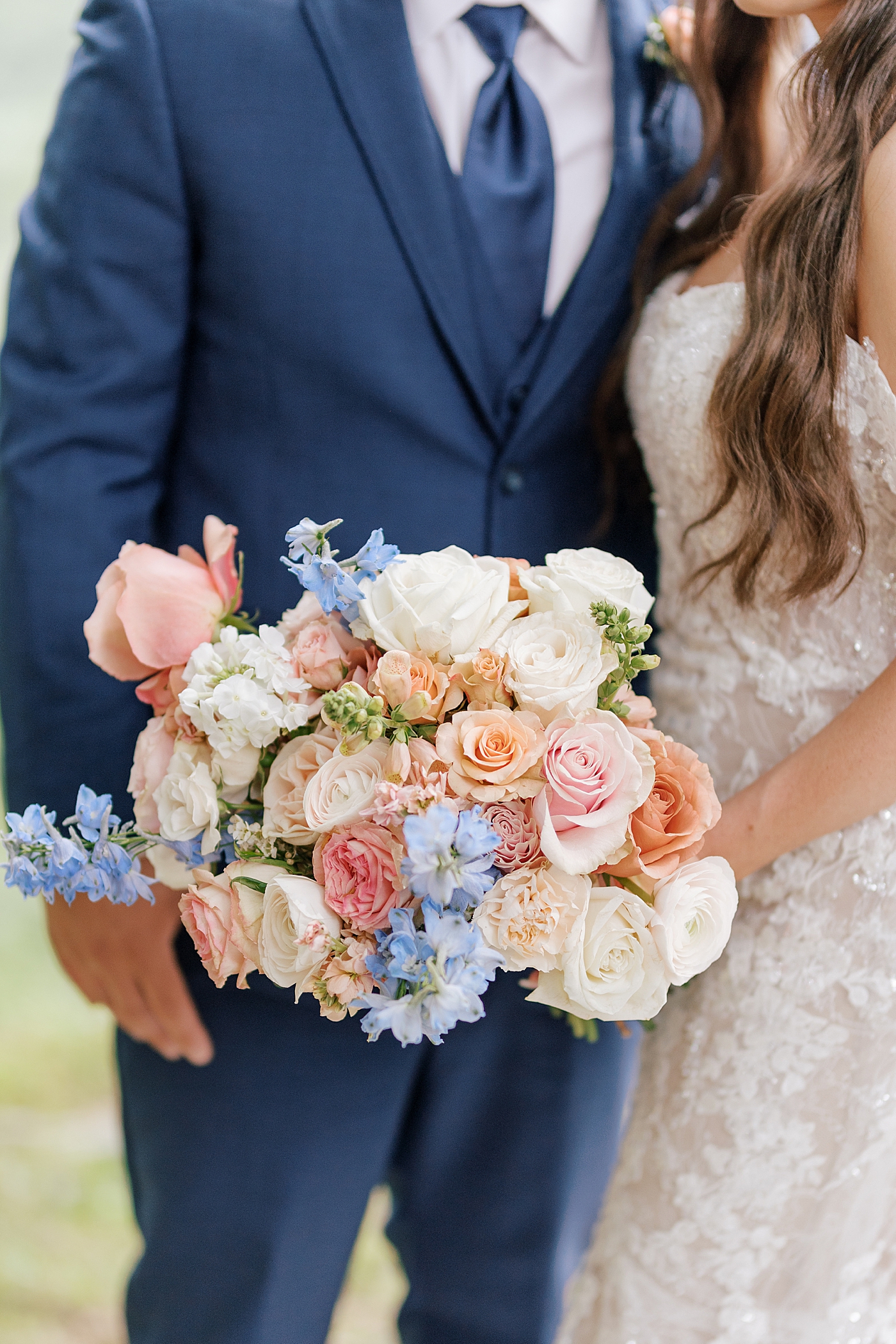 Detail of brides bouquet with pink and blue flowers | Image by Hope Helmuth Photography 