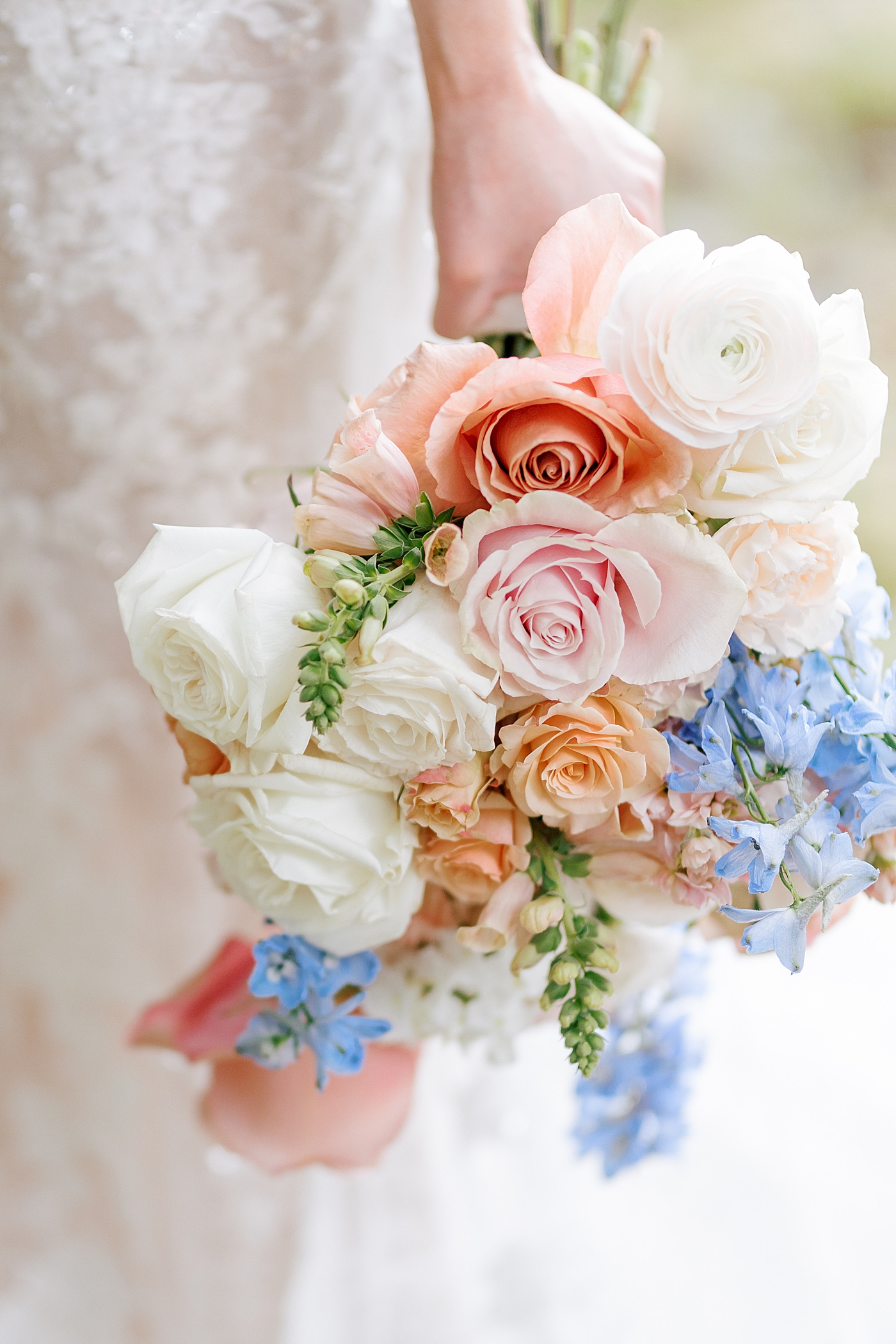 Detail of bride's hand holding her bouquet | Image by Hope Helmuth Photography 