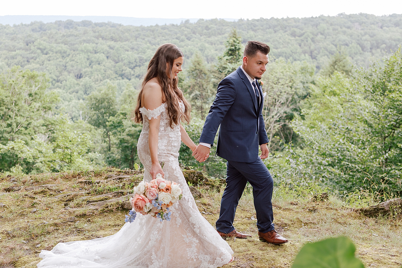 Bride and groom walking in the mountains | Image by Hope Helmuth Photography 
