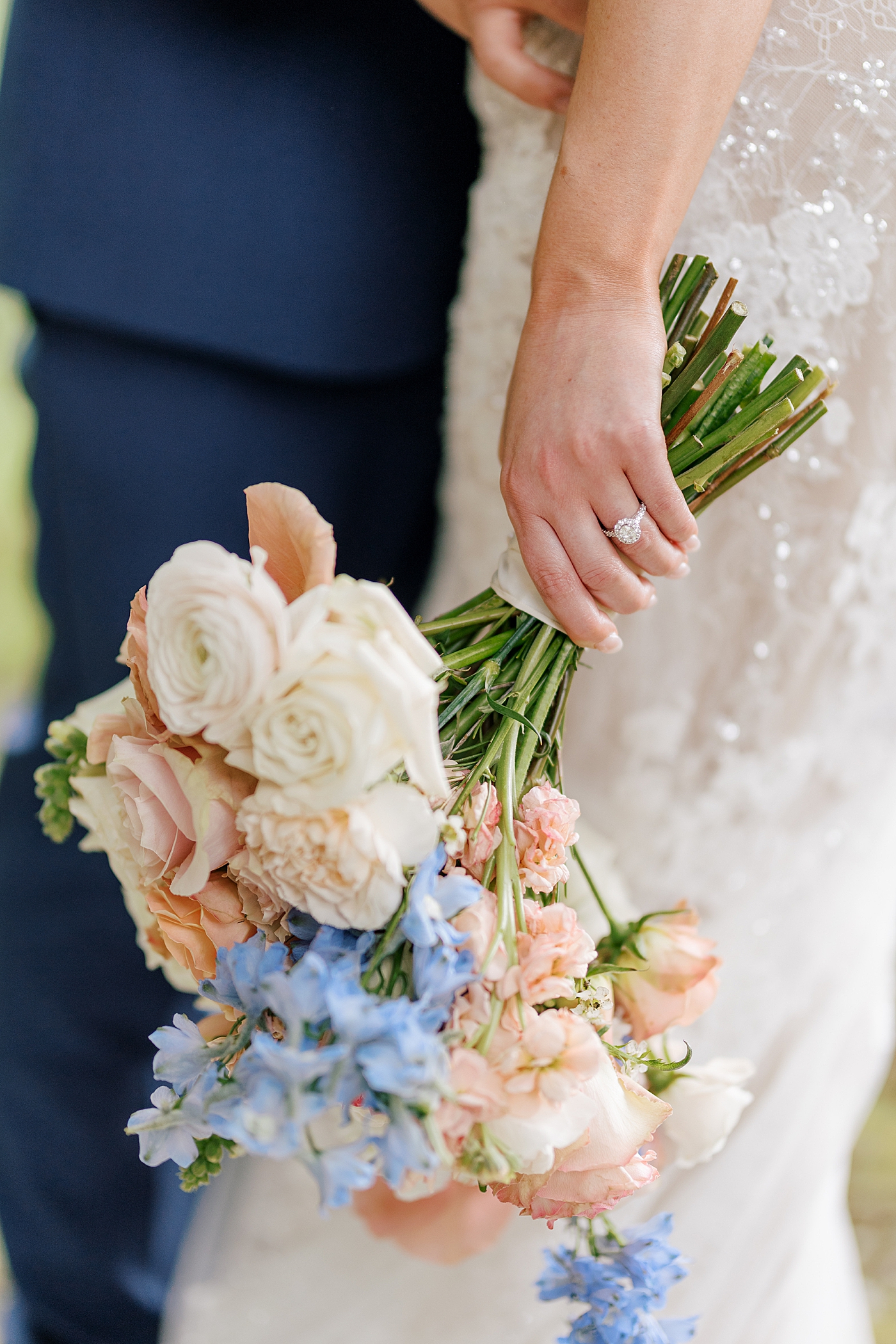Detail of brides ring as she holds her bouquet | Image by Hope Helmuth Photography 