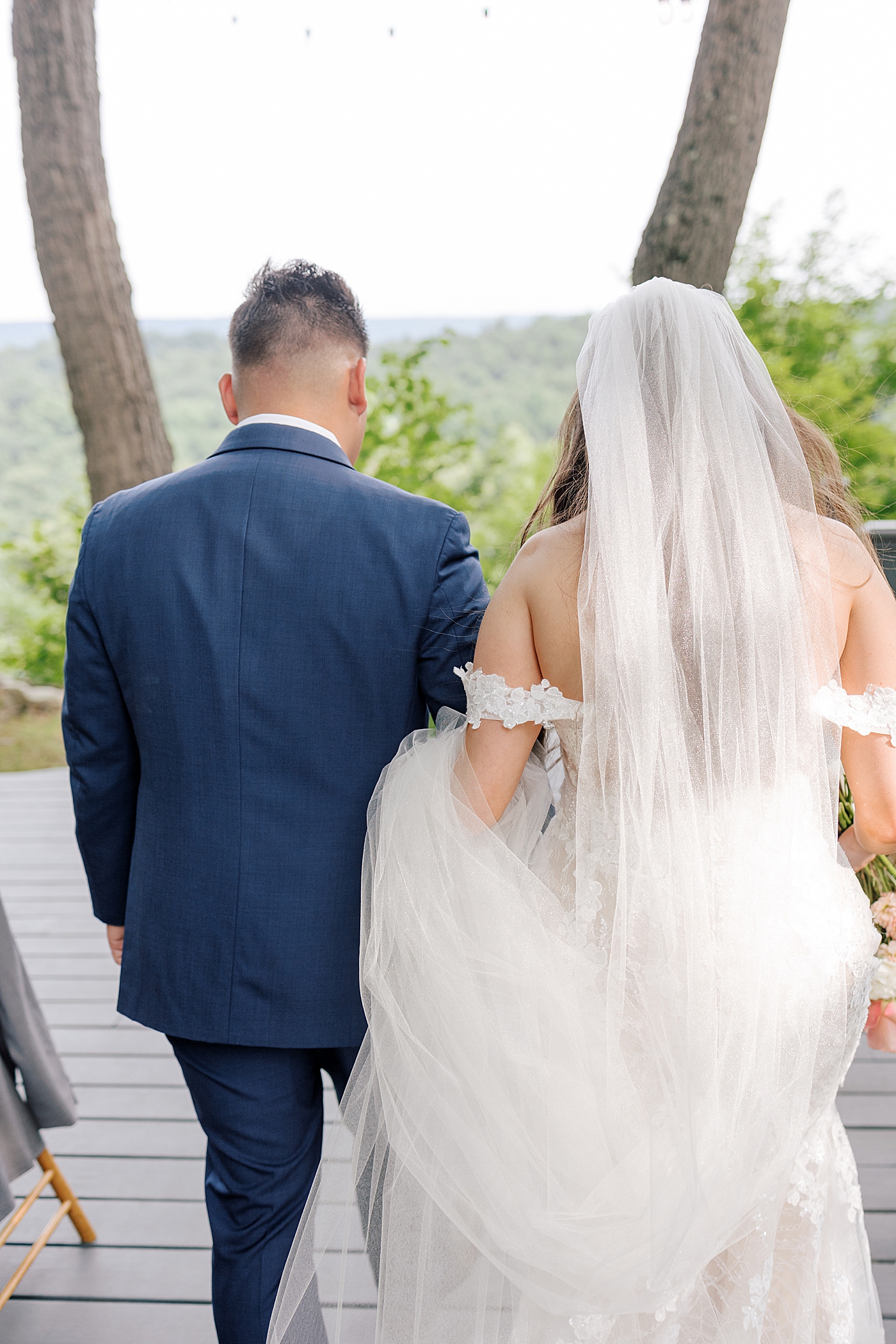 Bride and groom exiting their wedding during Promise Ridge Wedding | Image by Hope Helmuth Photography 