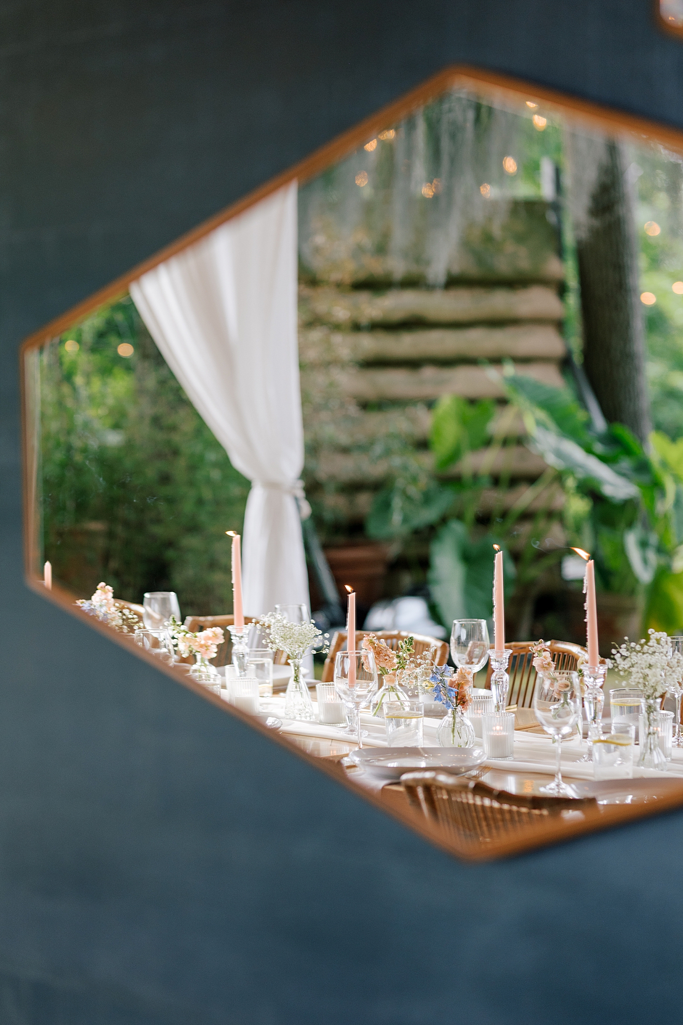 Reflection of reception table in a mirror during Promise Ridge Wedding | Image by Hope Helmuth Photography 