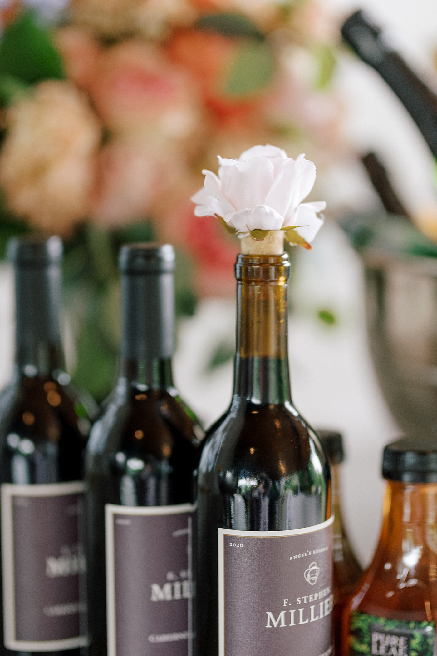 Bottles of wine during wedding reception | Image by Hope Helmuth Photography 