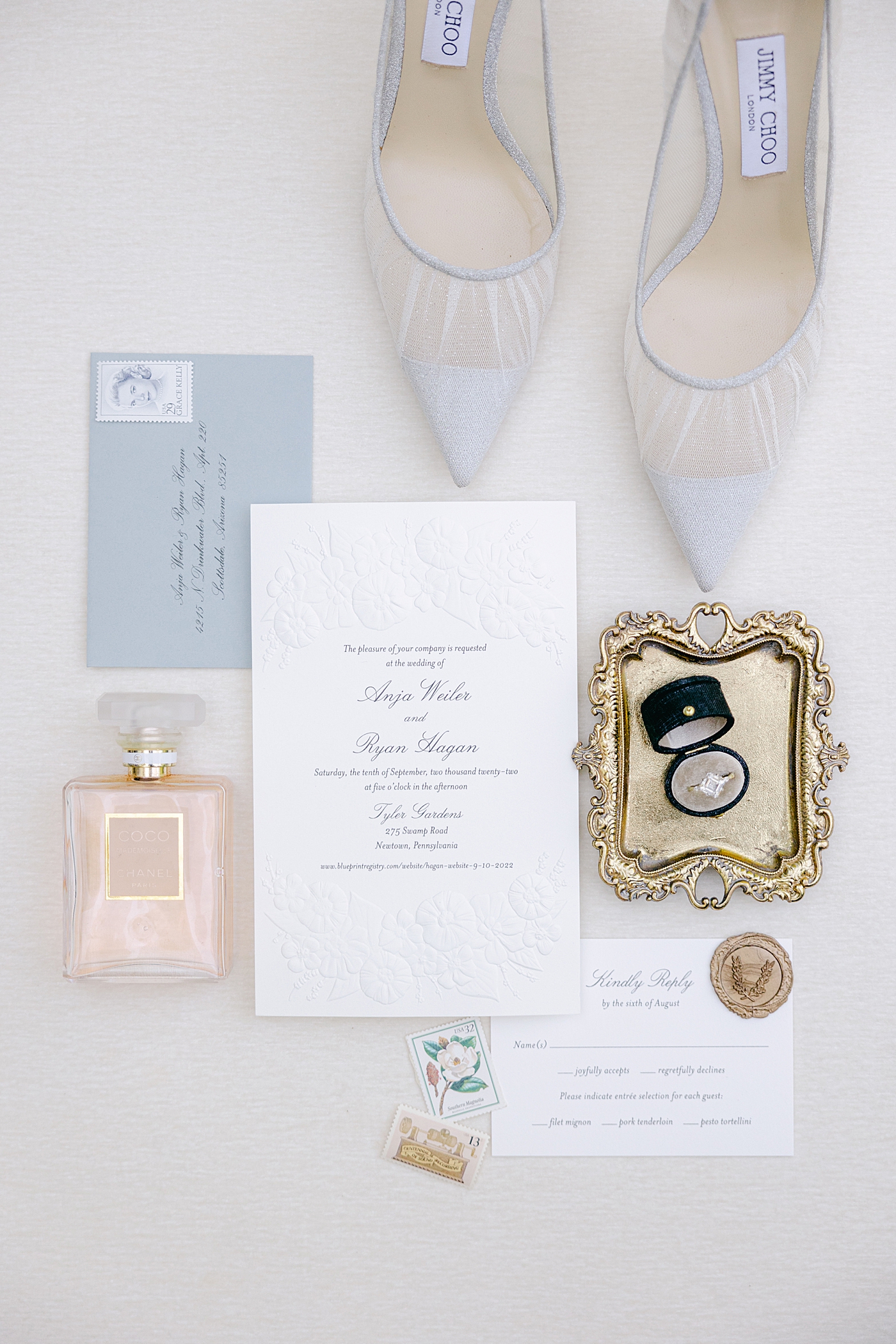 White and light blue flat lay of wedding details during Tyler Gardens Wedding | Image by Hope Helmuth Photography