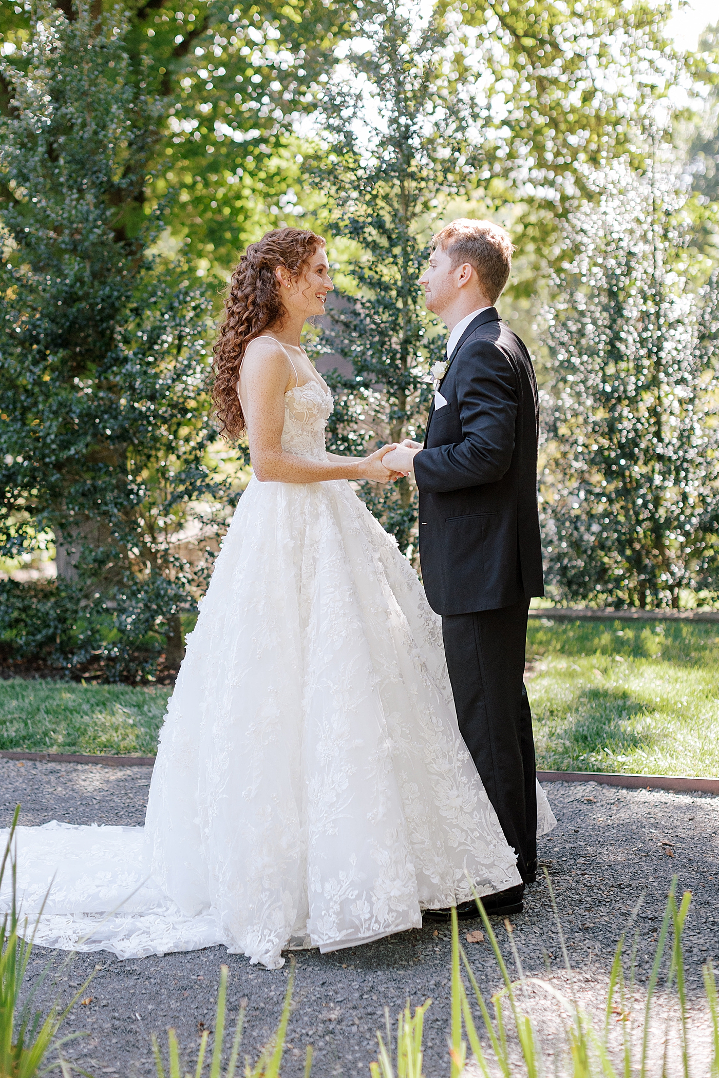 Bride and groom embracing at their first look during Tyler Gardens Wedding | Image by Hope Helmuth Photography