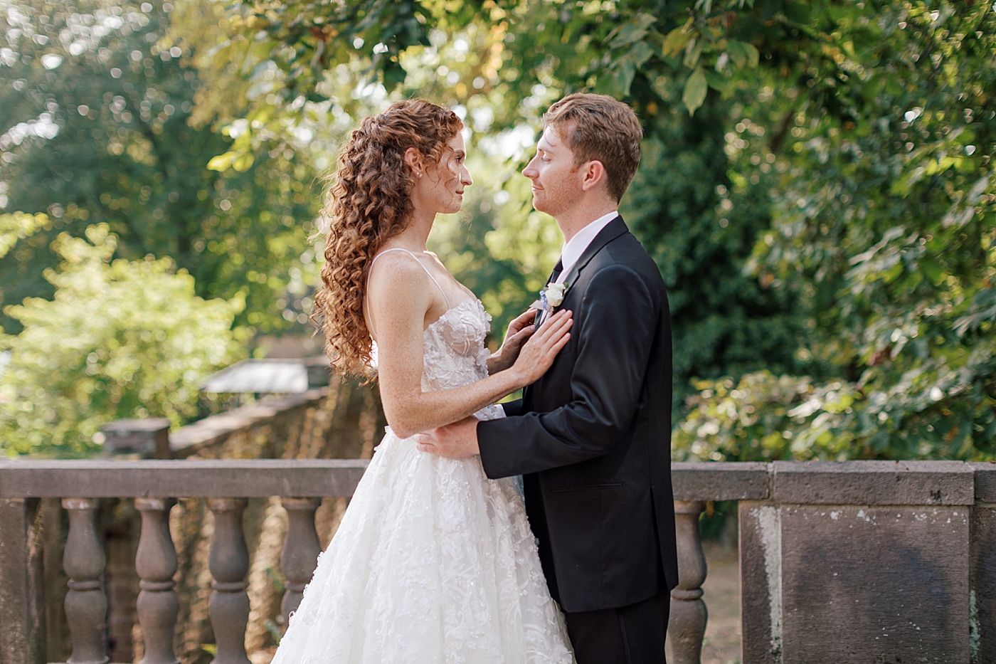 Bride and groom embracing during Tyler Gardens Wedding | Image by Hope Helmuth Photography
