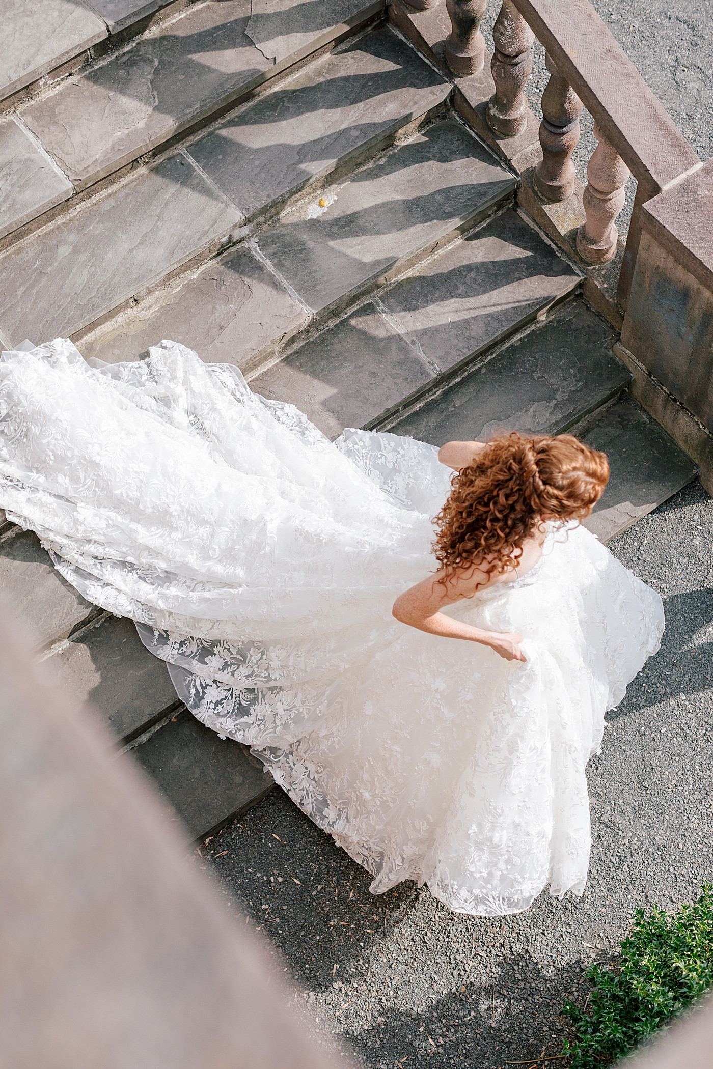 Bride walking down chateau steps during Tyler Gardens Wedding | Image by Hope Helmuth Photography