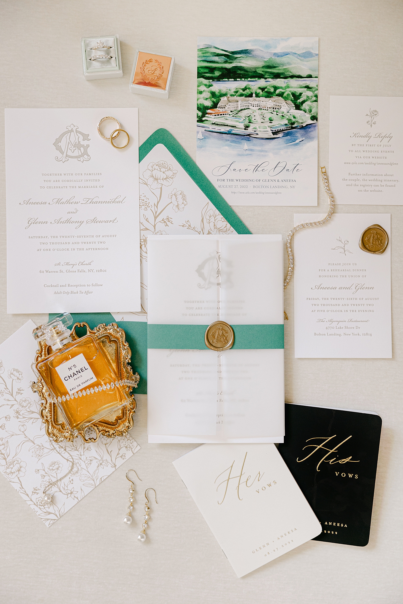 White, green, and gold flat lay of wedding details during their Sagamore Wedding | Image by Hope Helmuth Photography