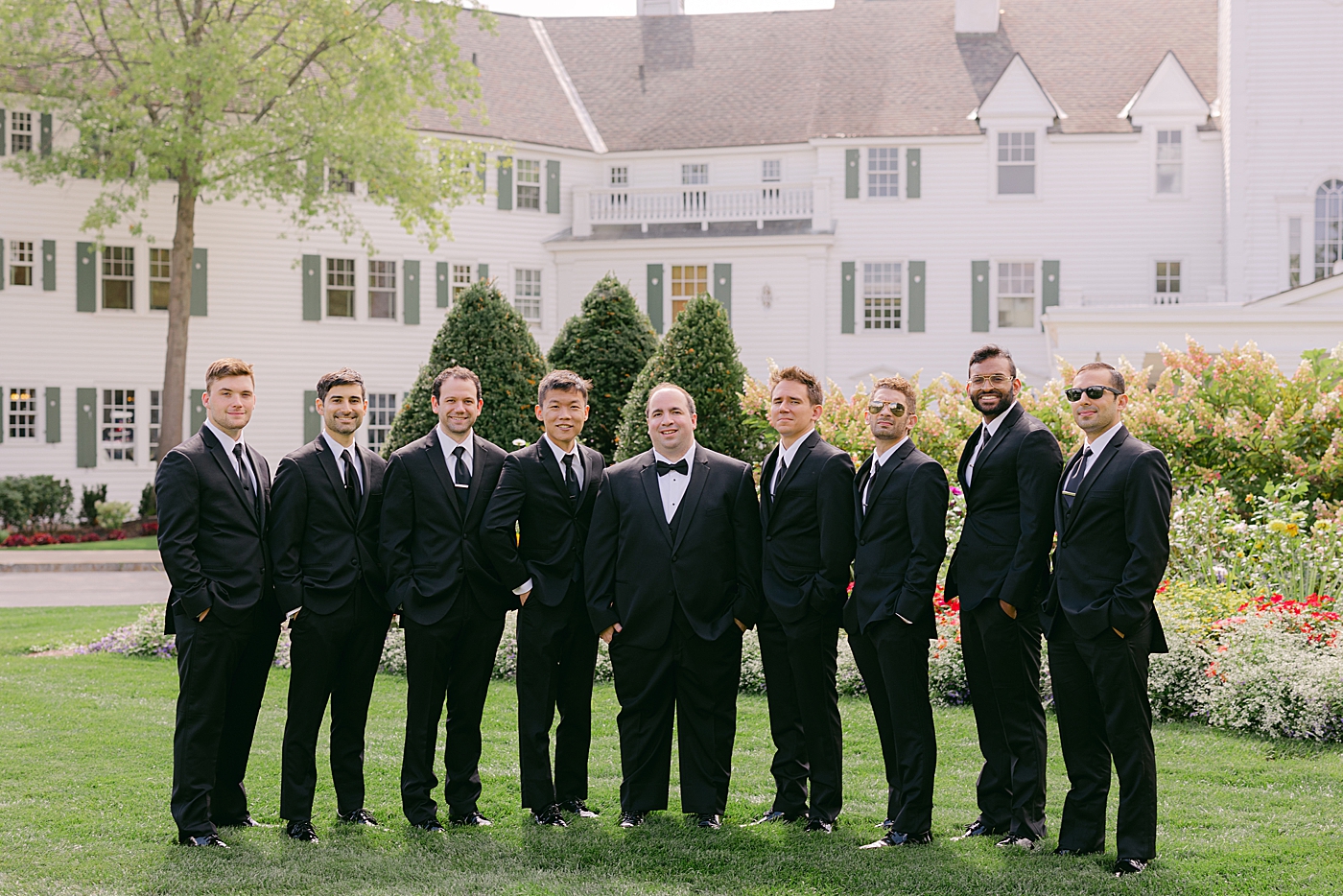 Formal portrait of a groom and his groomsmen outdoors | Image by Hope Helmuth Photography