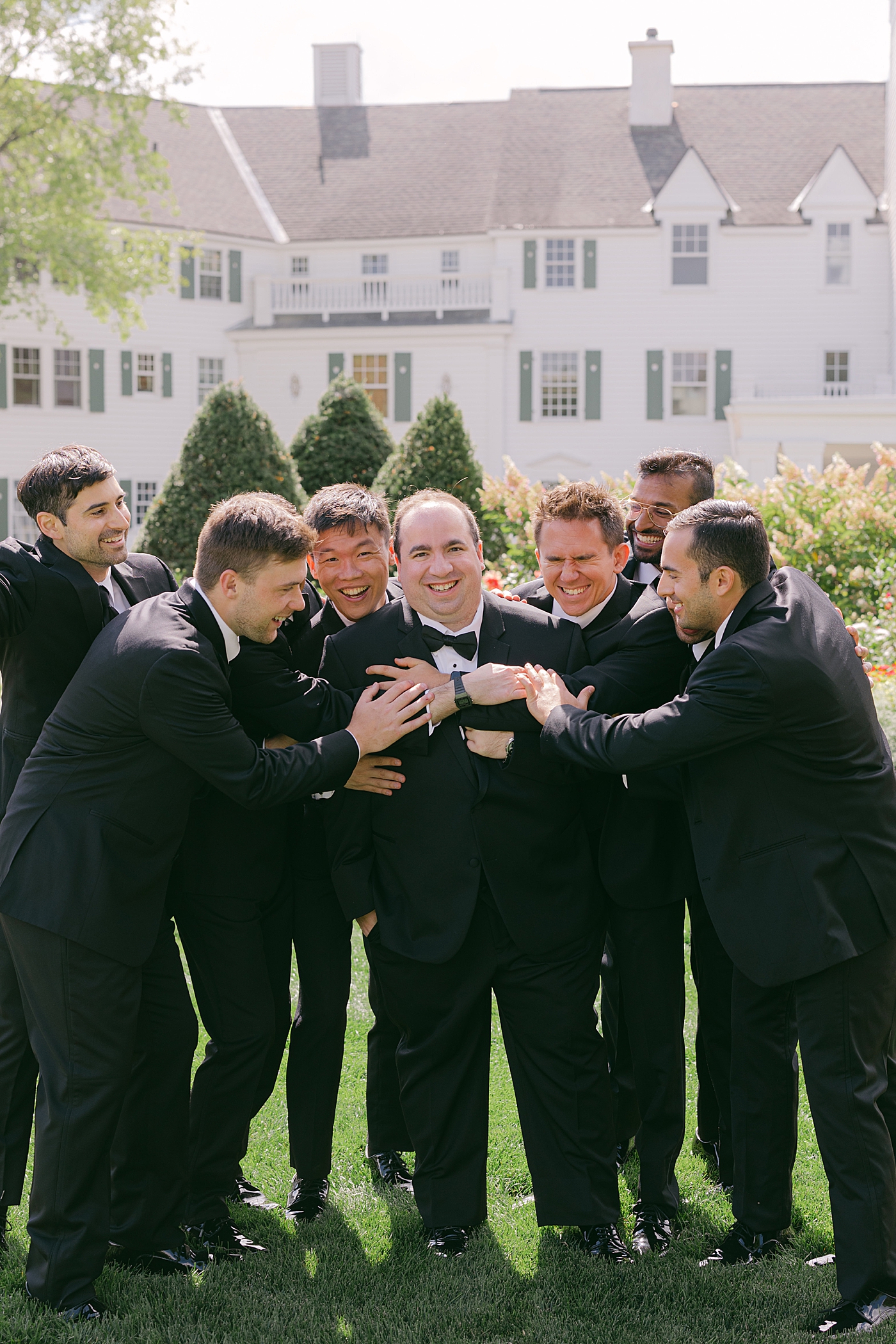 Informal portrait of a groom and his groomsmen | Image by Hope Helmuth Photography