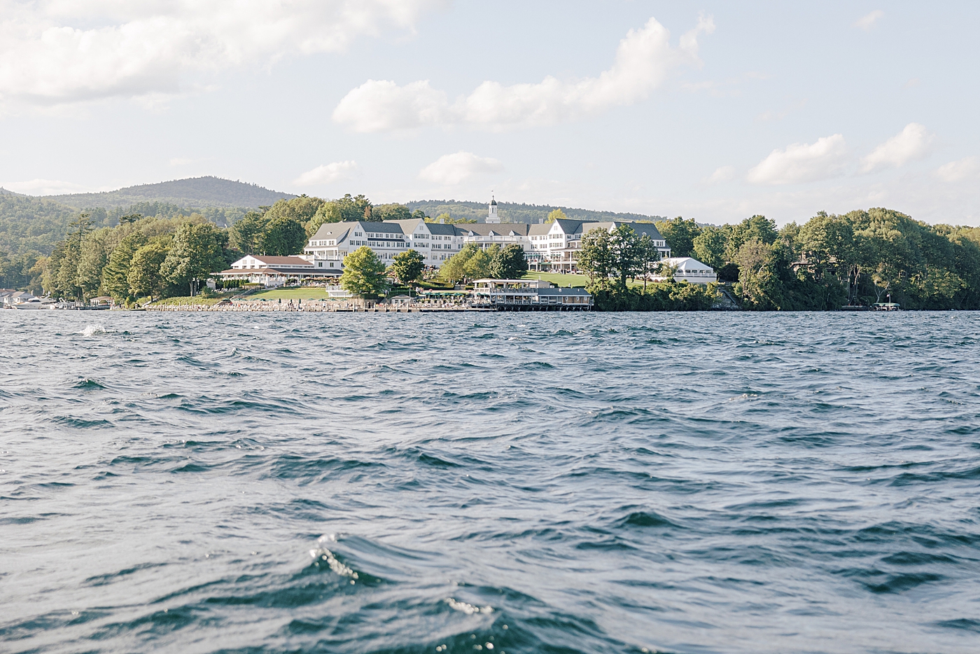 Location image of the venue from a boat on the water | Image by Hope Helmuth Photography