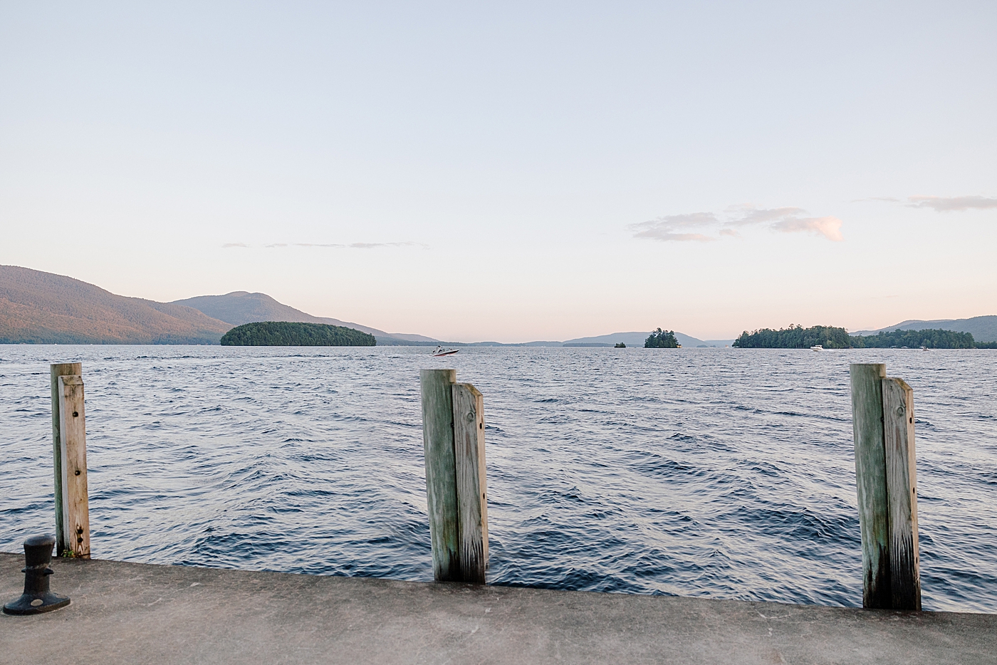 Location image of a dock in the harbor and water at sunset | Image by Hope Helmuth Photography