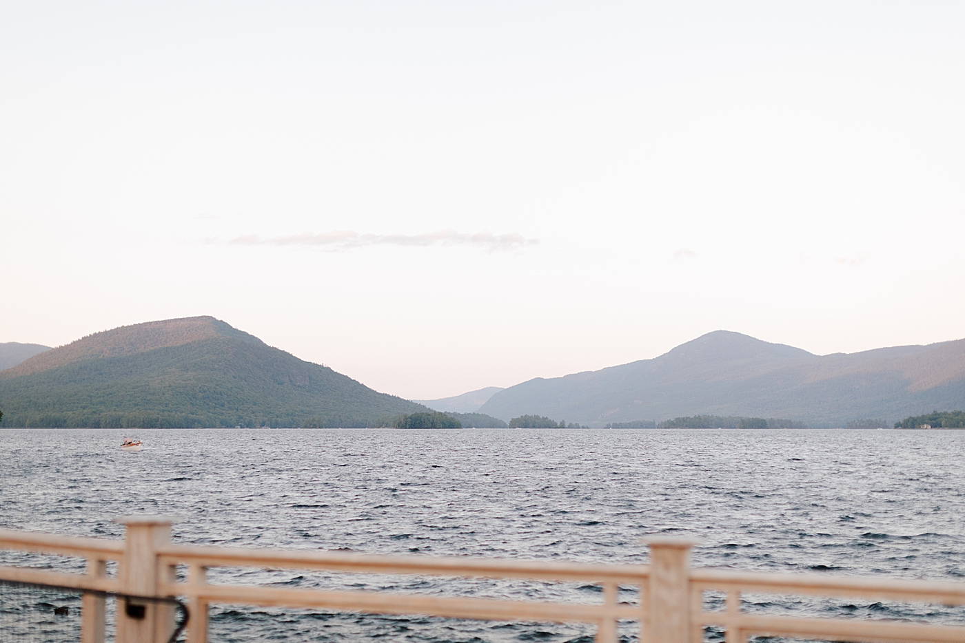 Location image of harbor at sunset with mountains in the background | Image by Hope Helmuth Photography