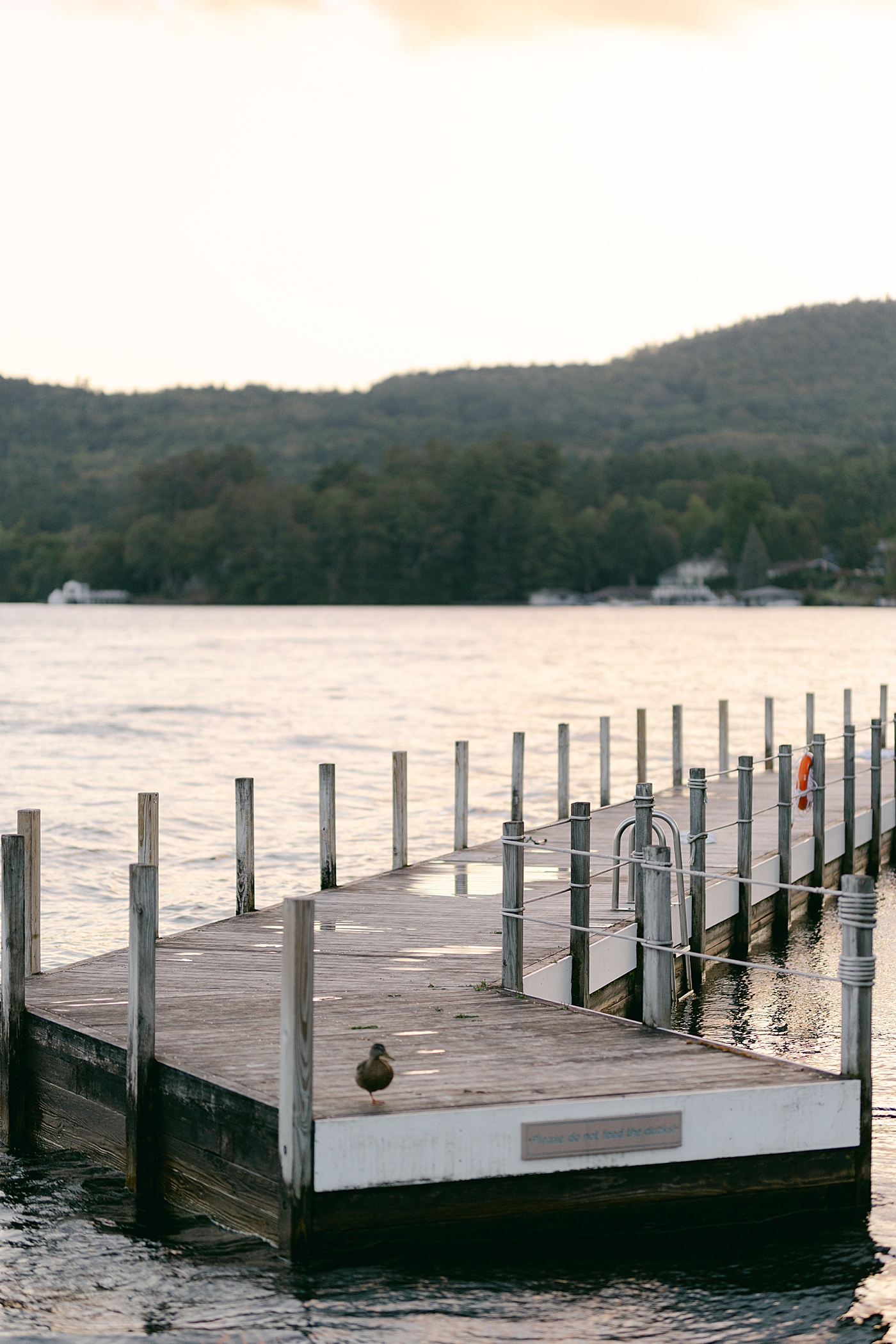 Location image of a harbor dock at sunset during Sagamore Wedding | Image by Hope Helmuth Photography