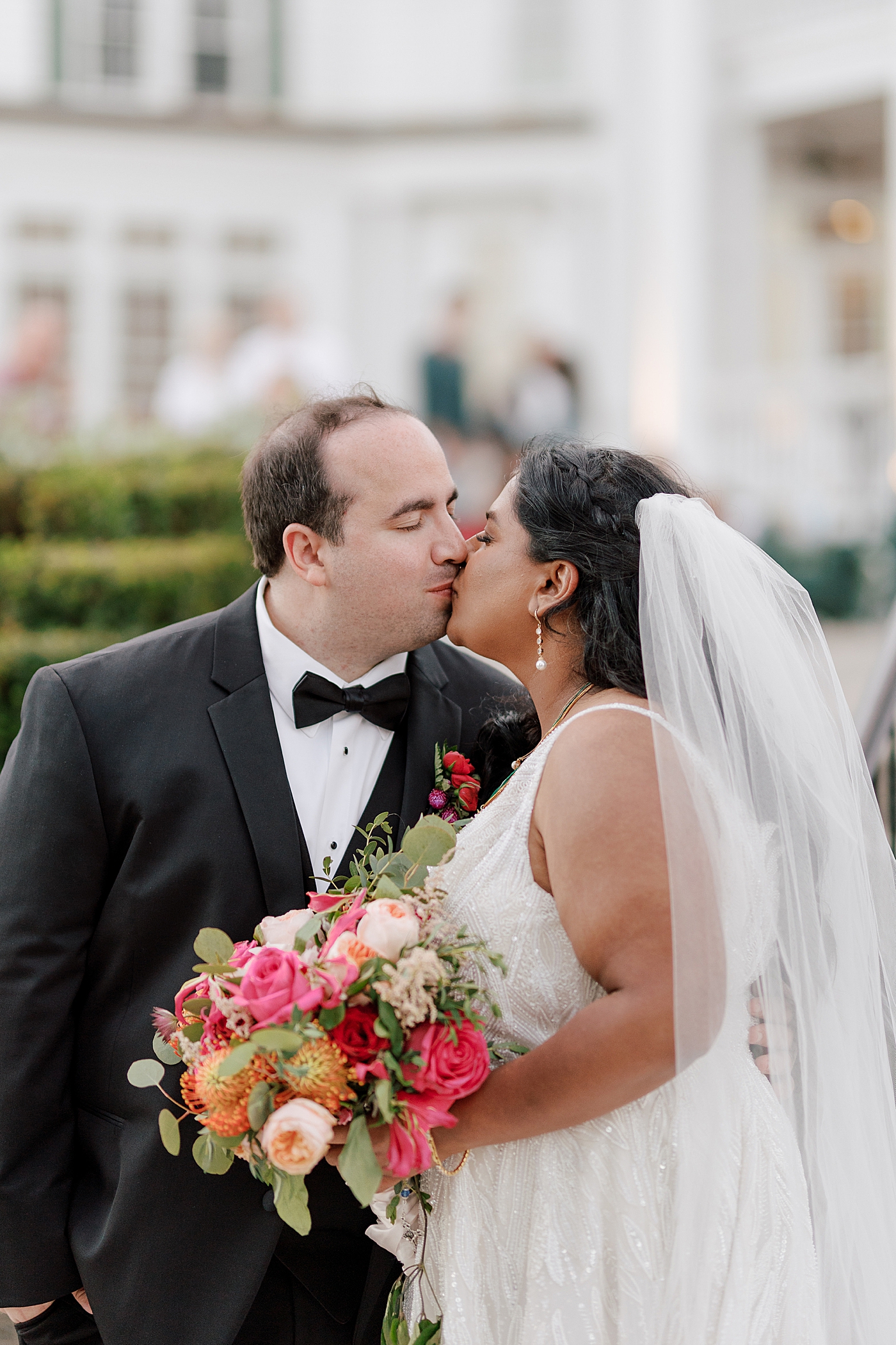 Bride and groom kissing during their Sagamore Wedding | Image by Hope Helmuth Photography