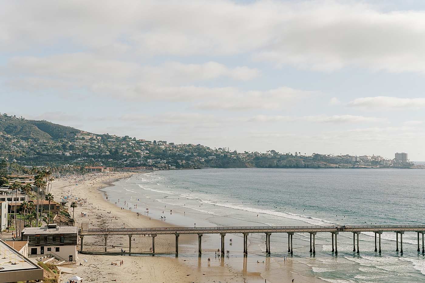 Location detail wide shot of beach pier and tropical landscape | Image by San Diego Wedding Photographer Hope Helmuth