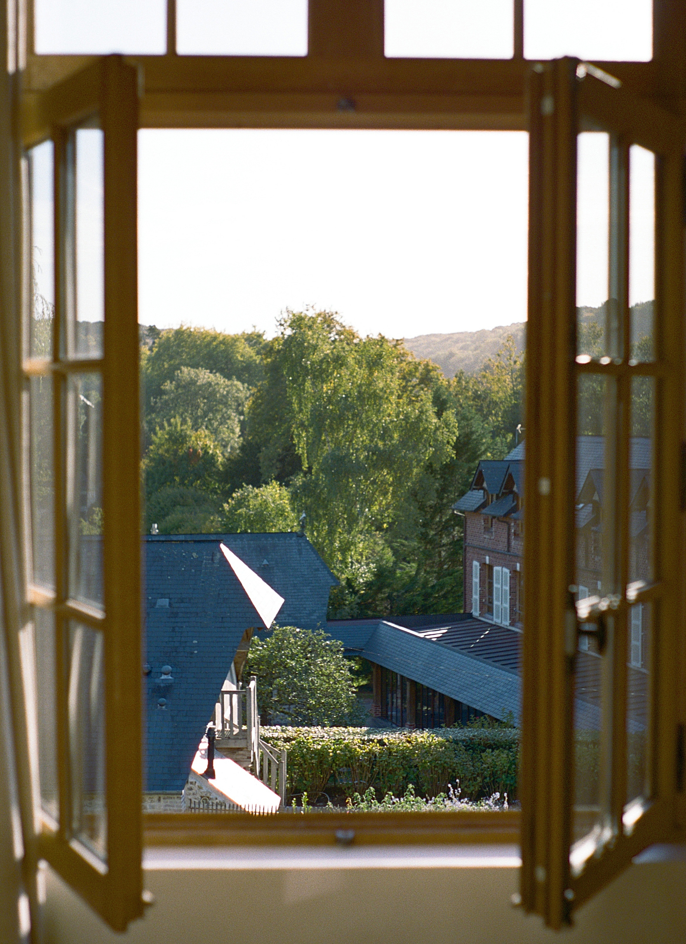 Image of a French countryside through a window frame with soft morning light | Image by Hope Helmuth Photography