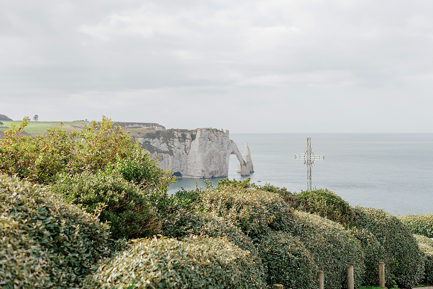 View of tall French cliffs in the back ground, calm water from high on a hill | Image by Hope Helmuth Photography