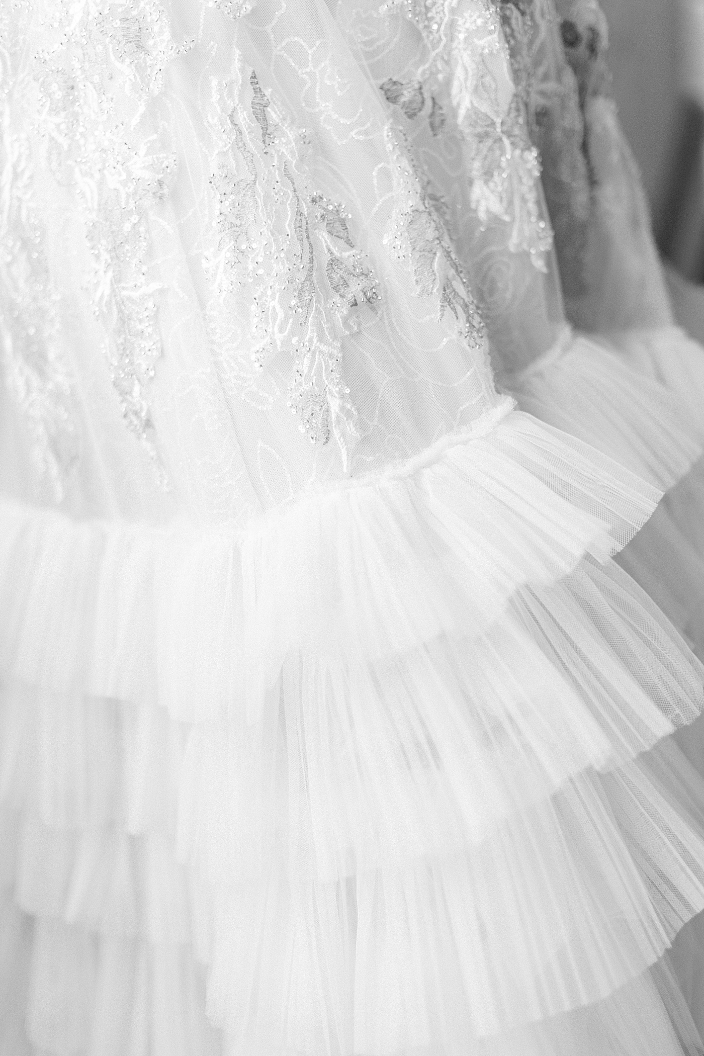 Black and white image of wedding dress details during Paris Elopement | Image by Hope Helmuth Photography