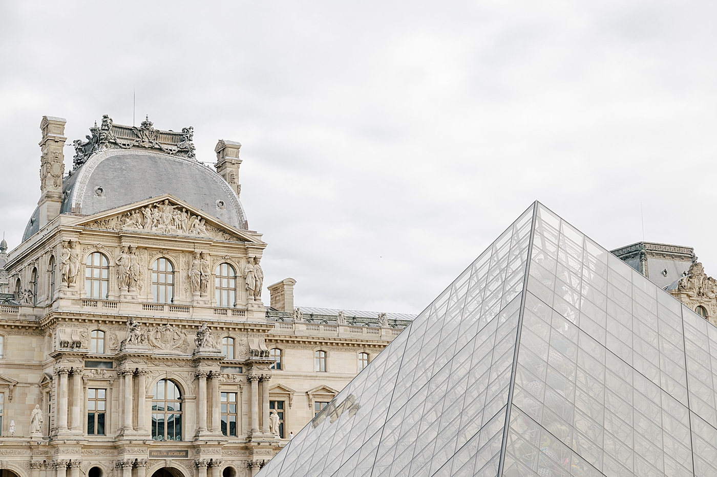 Location imagery of the outside of the Louvre in Paris | Image by Hope Helmuth Photography