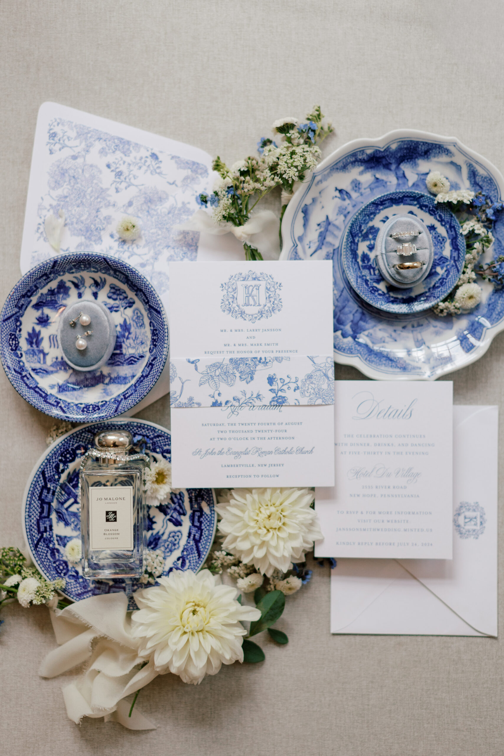 Toile blue plates and wedding invitation styled in a flat lay | Image by Hope Helmuth Photography