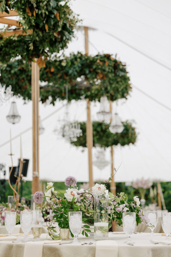 Tented reception setup with sage, purple, and blush details at a spring North Carolina wedding