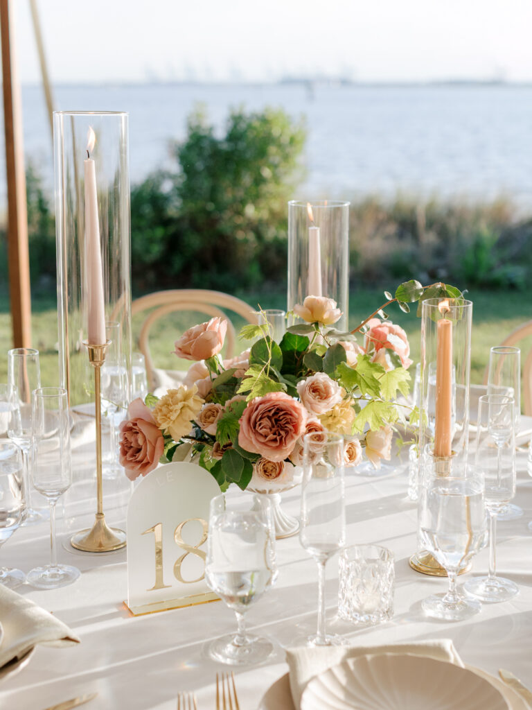 Sailcloth tented reception setup at Hermitage Museum wedding with colorful floral arrangements.