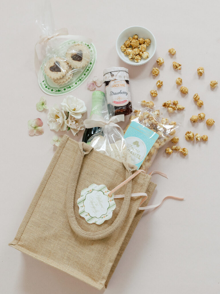 Thoughtful guest welcome bag with locally sourced treats for a luxury destination wedding weekend